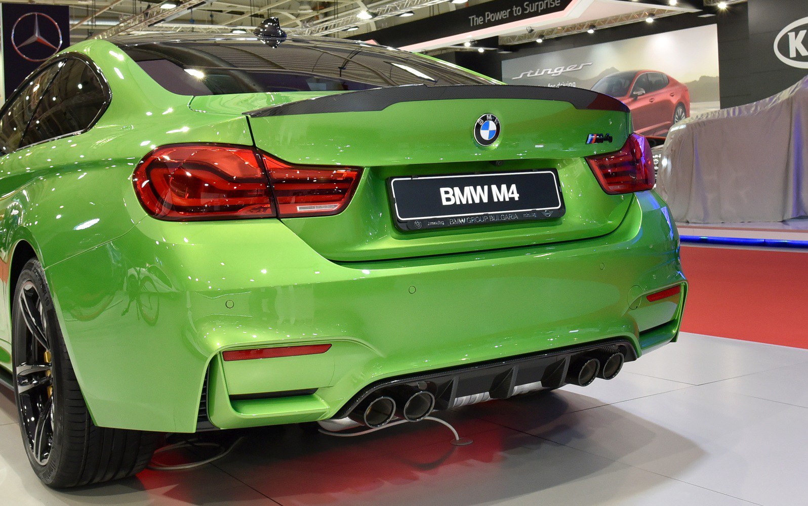 Rear view of sports coupe with quad exhaust and distinctive taillights