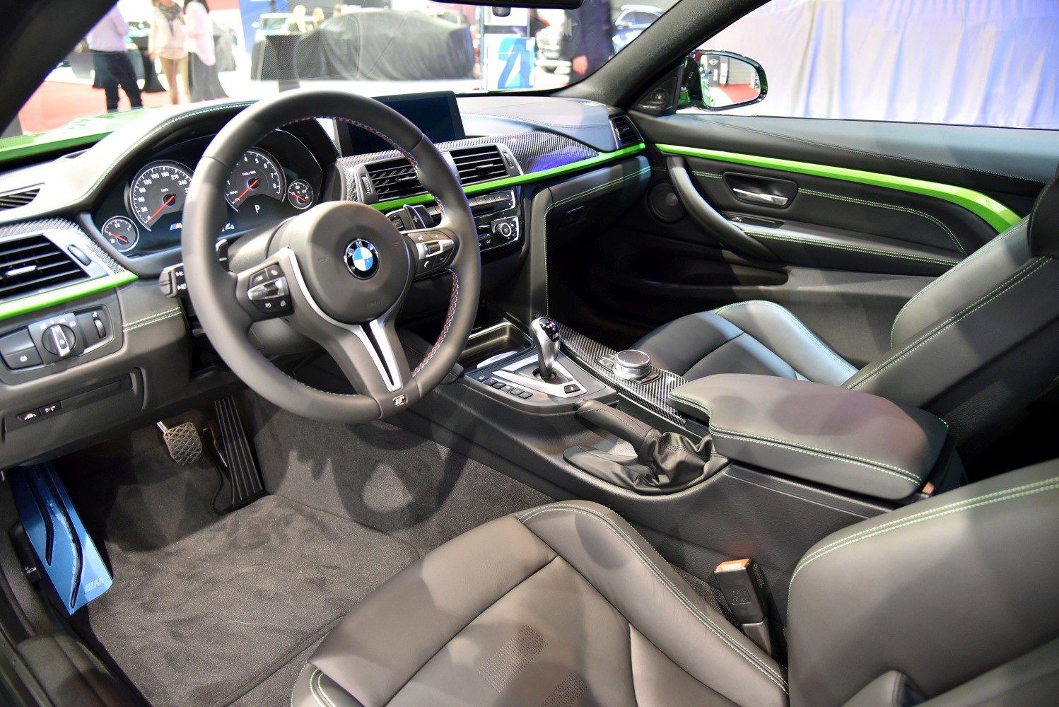 Carbon fiber dashboard with green trim and leather sport seats