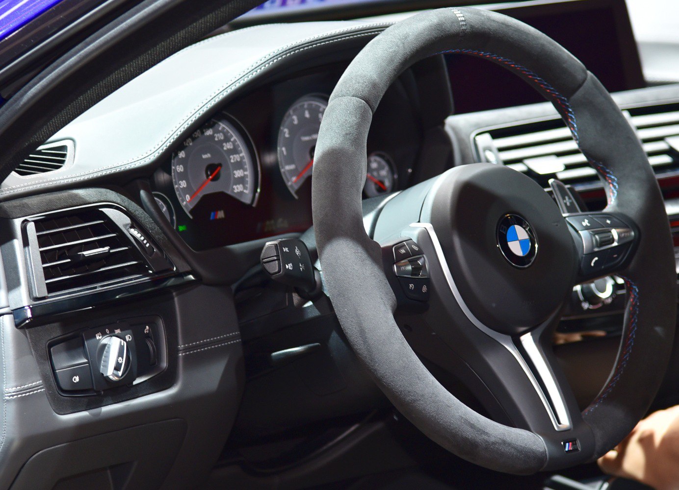 Alcantara steering wheel with M stitching and detailed gauge cluster