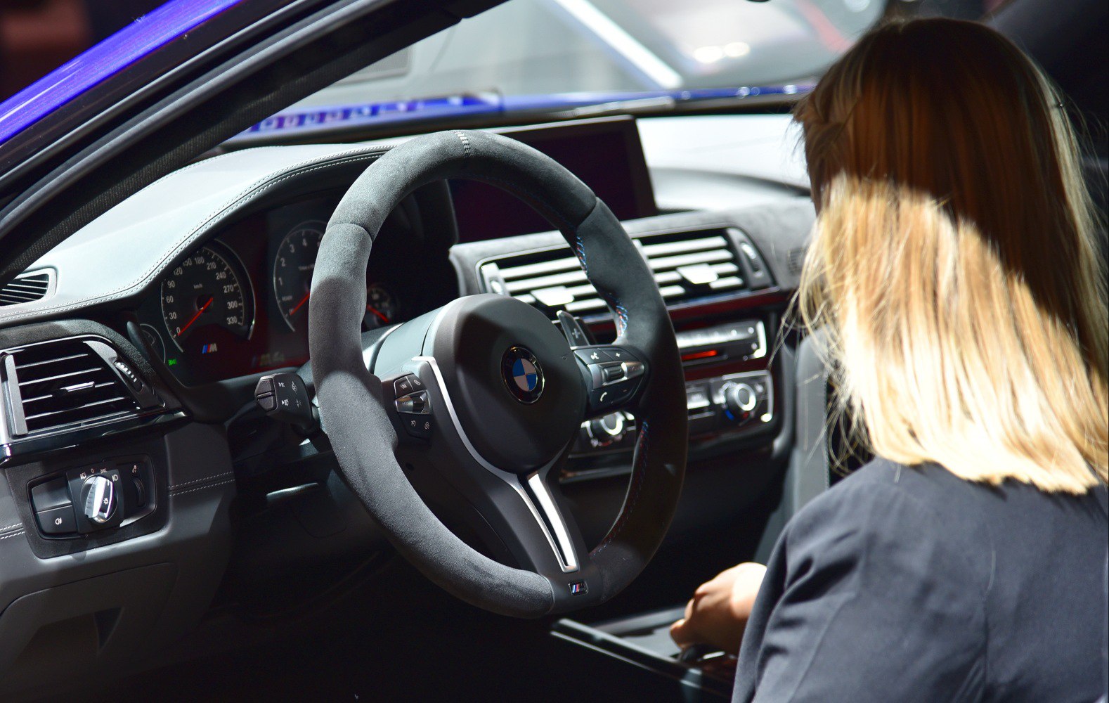 Alcantara steering wheel and detailed dashboard with instrument cluster.