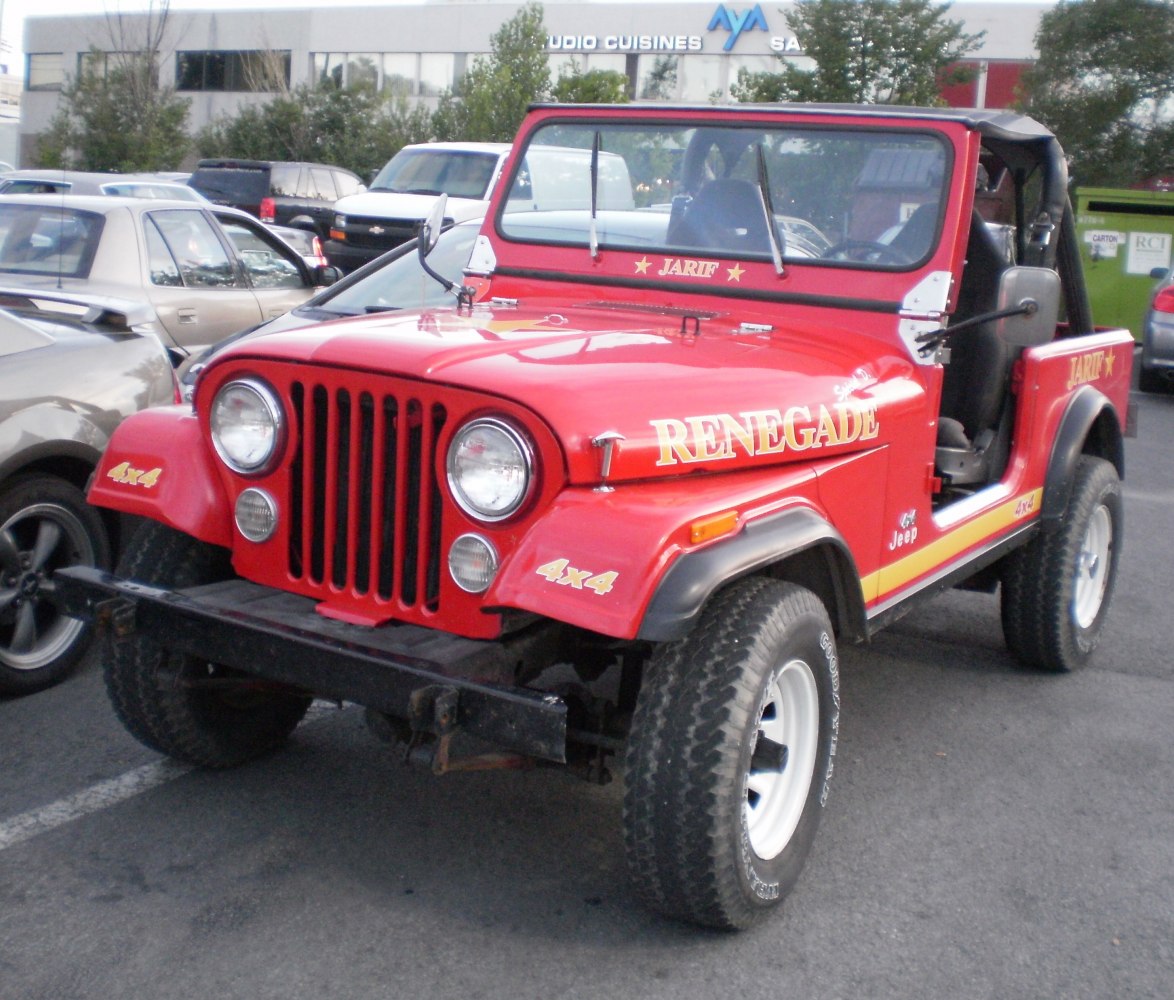 Red off-road vehicle with vertical grille, 4x4 tires and open sides