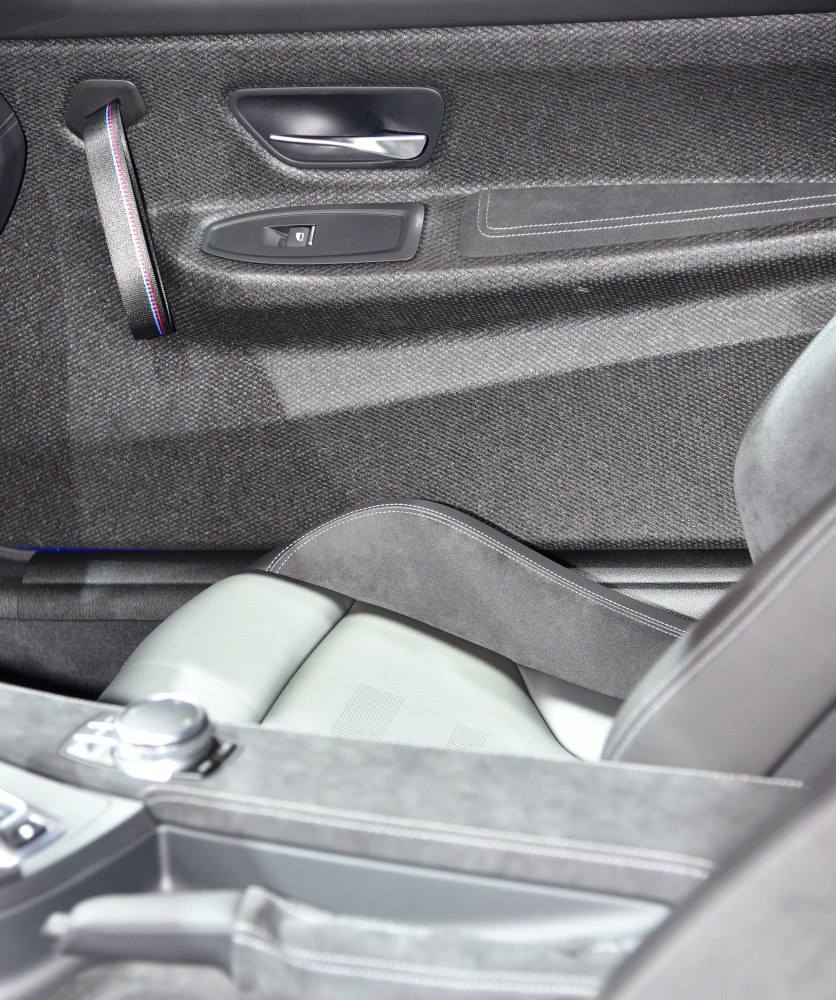 Interior door panel with window control and premium sports seat upholstery