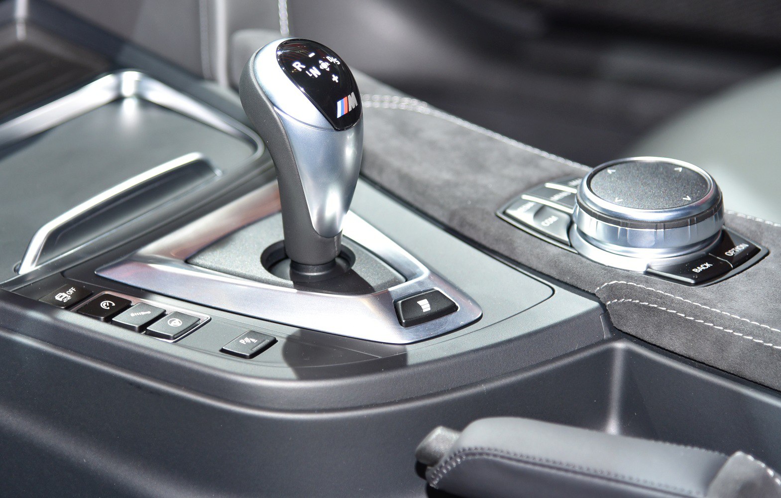 Gear shift lever and control dial on car center console