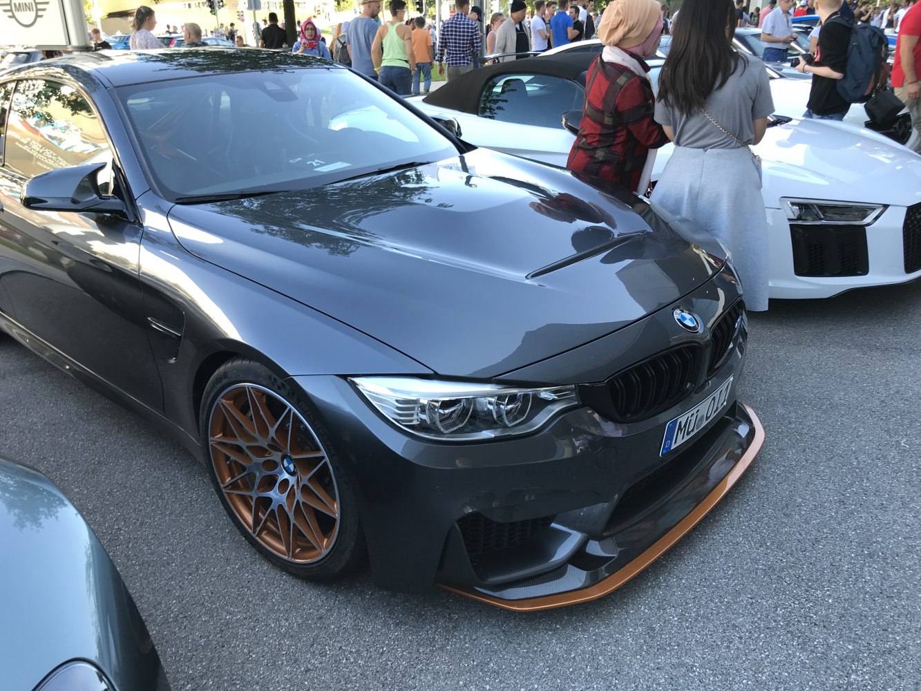 BMW M4 F82 front with bronze multi-spoke wheels and carbon fiber splitter