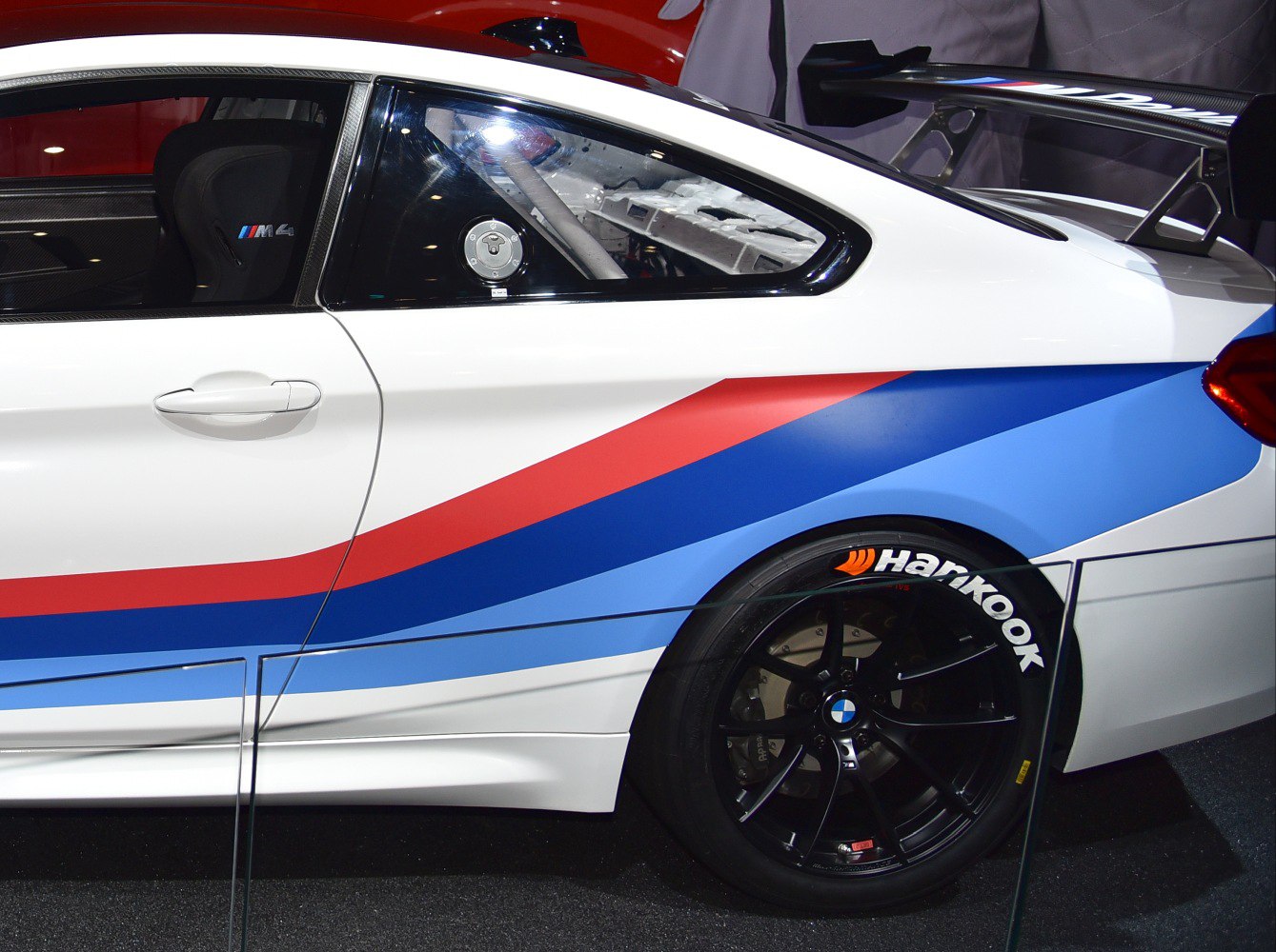 Side profile with Hankook tires, M stripes, and carbon fiber racing seat