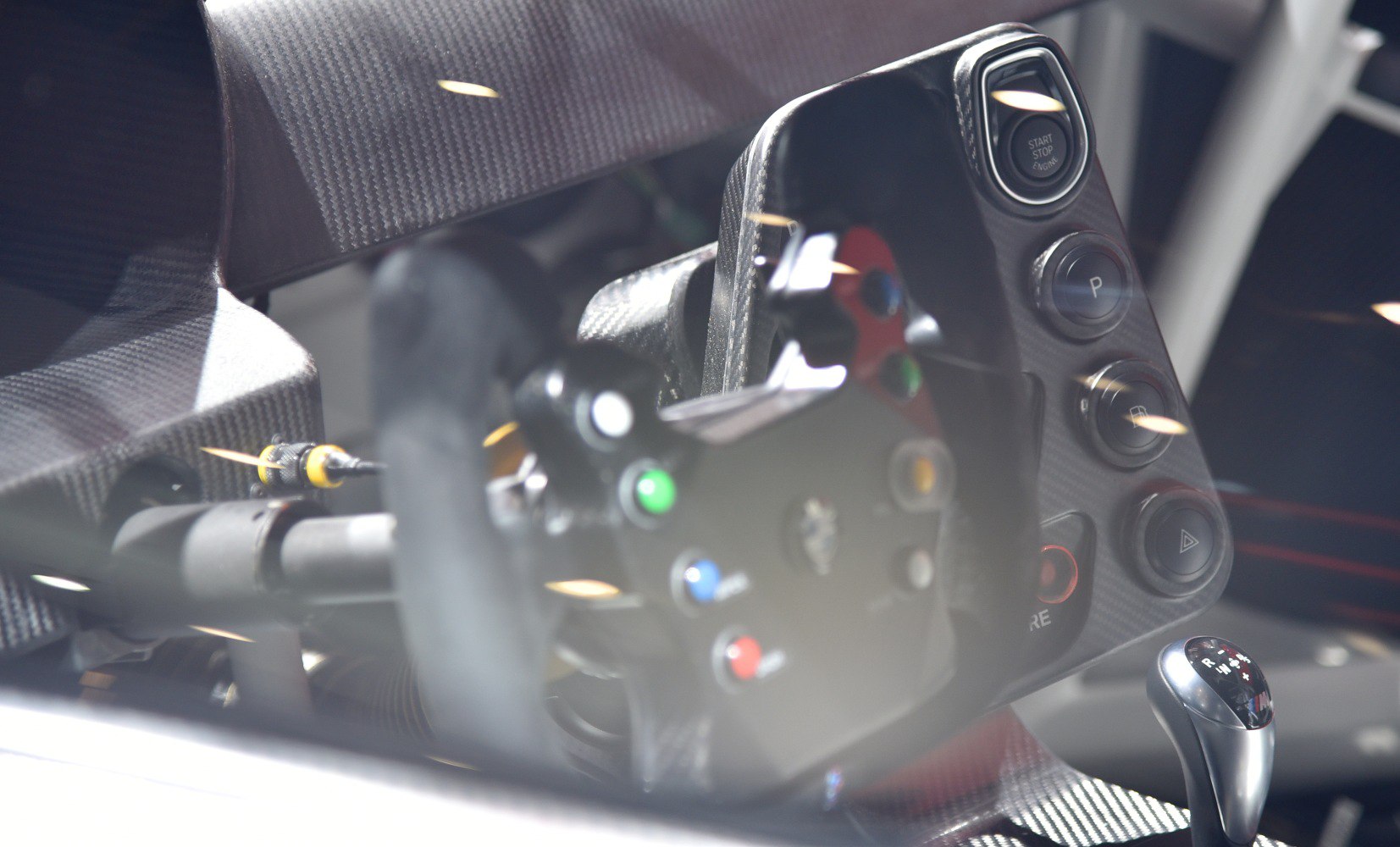 Racing steering wheel and gear shifter with carbon fiber panel