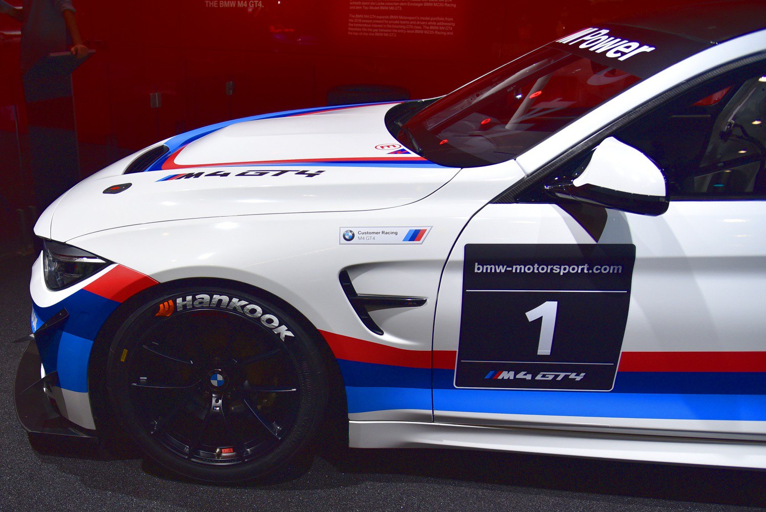 Front side of BMW M4 GT4 with Hankook tires and racing livery