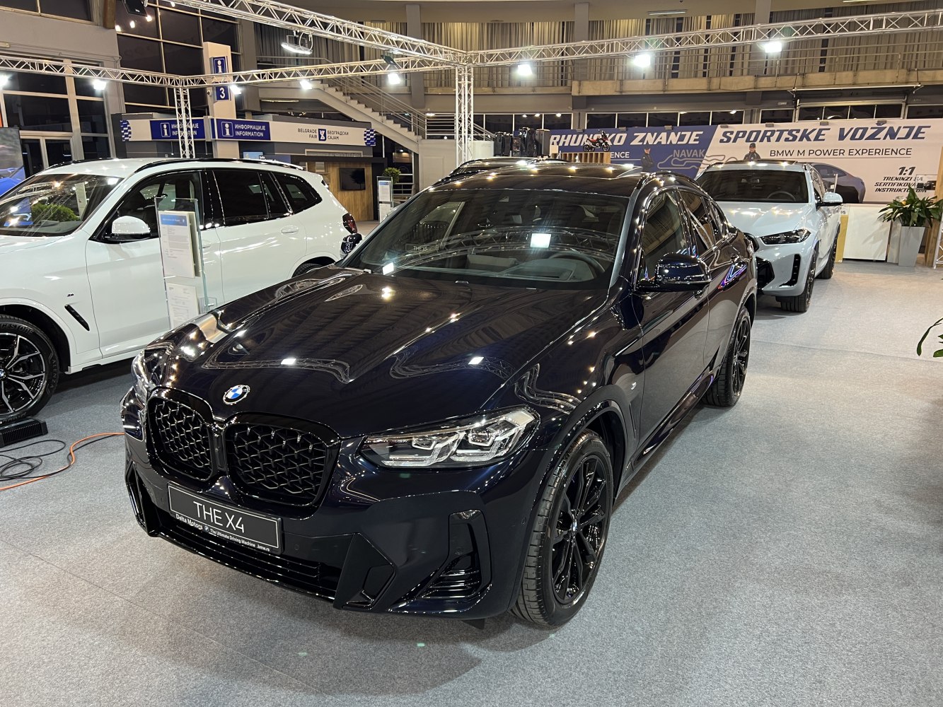 Front view with kidney grille and LED headlights of a black luxury SUV