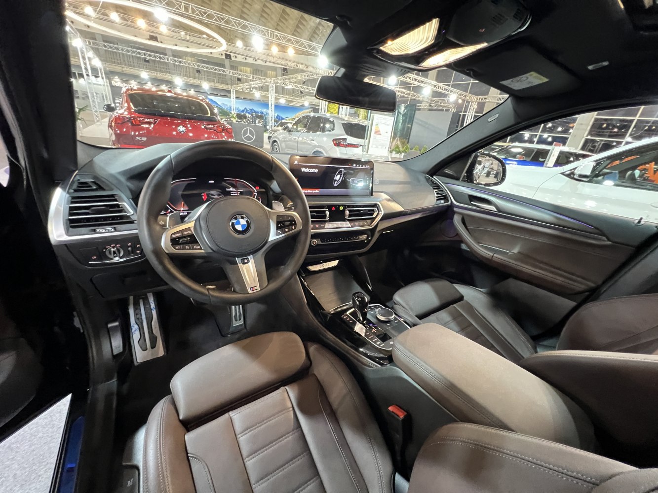 Luxury steering wheel and digital dashboard inside a modern vehicle