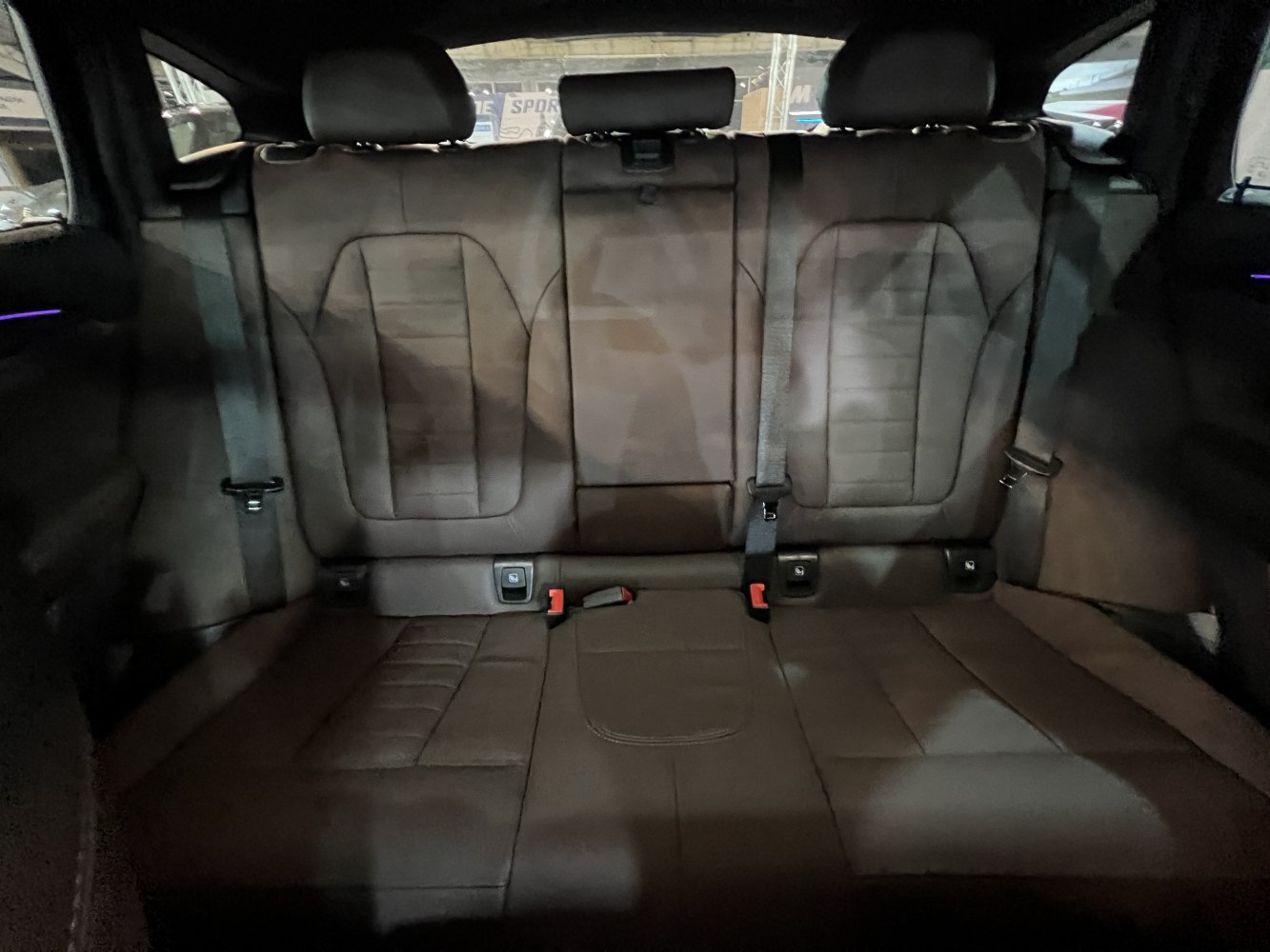 Rear leather seats with seatbelts and headrests