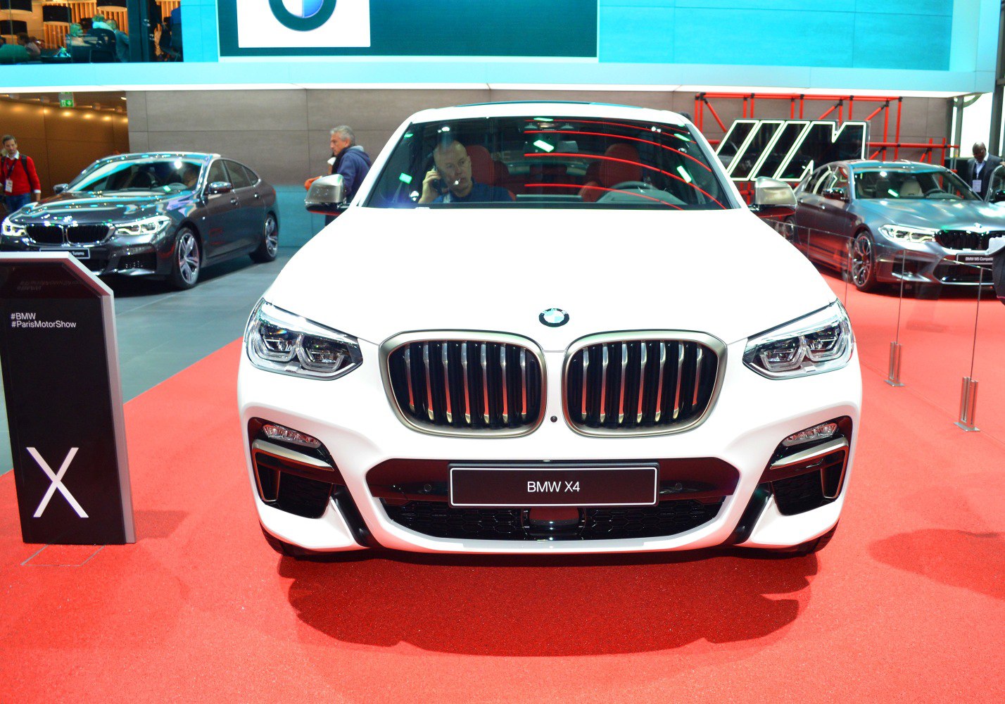 Front grille and LED headlights of a modern luxury SUV.