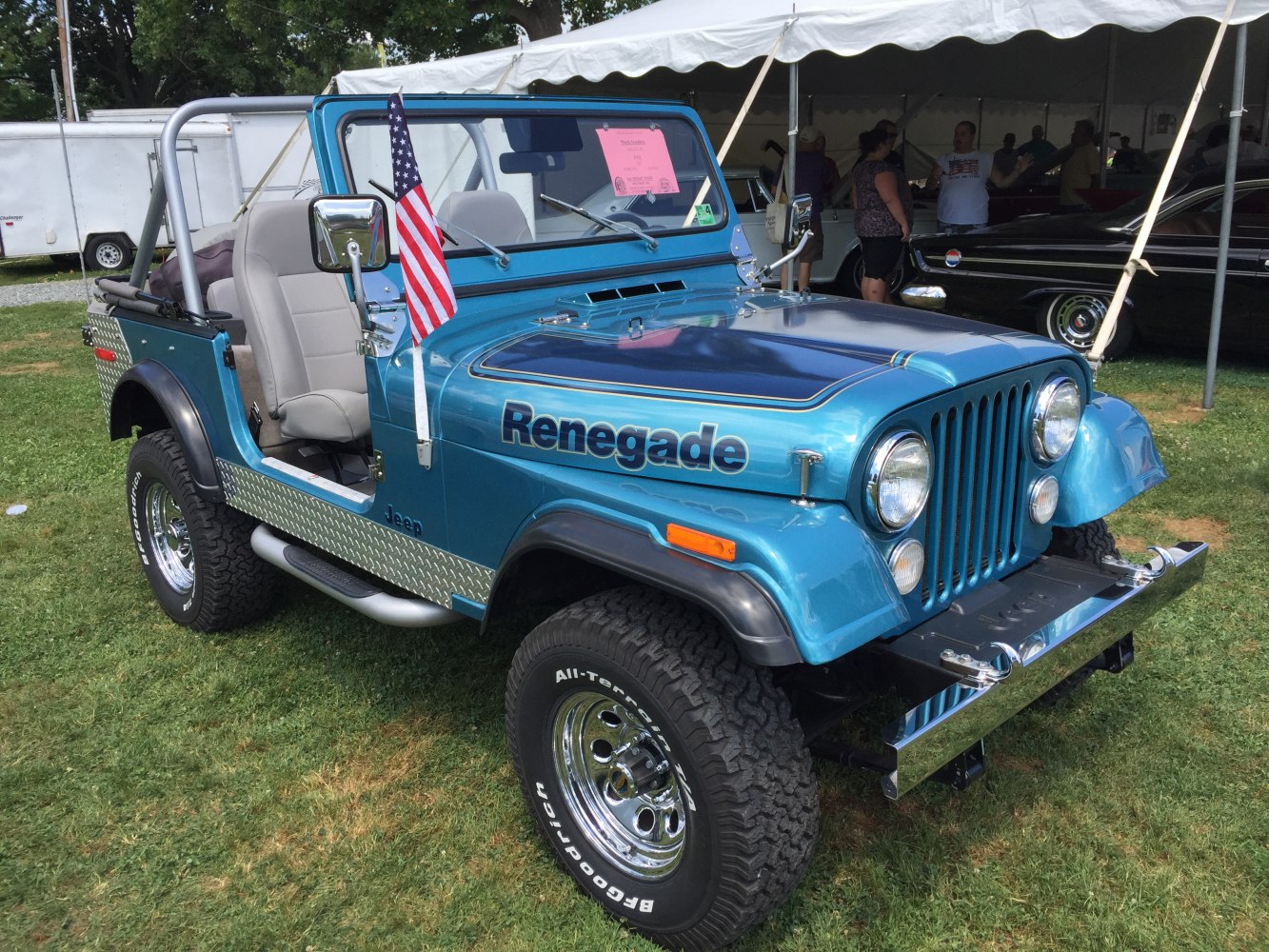 Open-top off-road vehicle with Renegade decal and roll cage