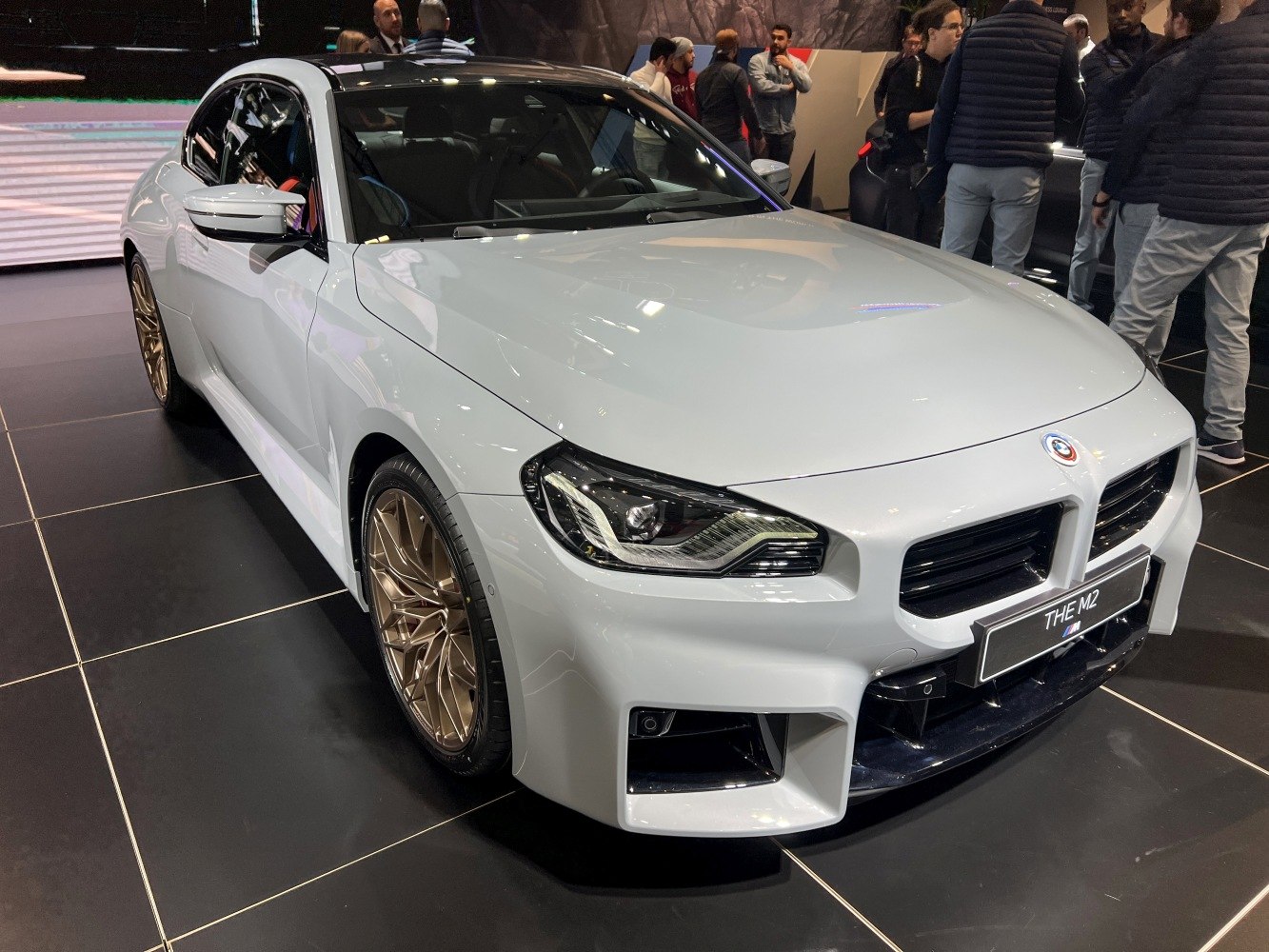 Aggressive front fascia with sharp LED headlights and distinctive gold wheels