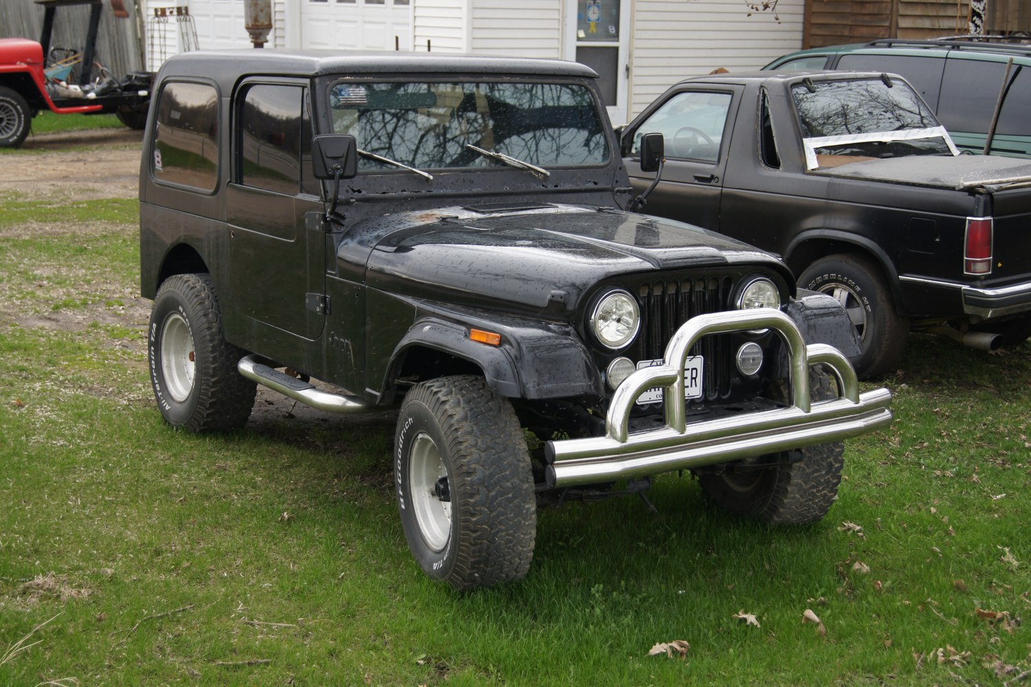 Rugged off-road SUV with large off-road tires and chrome bull bar