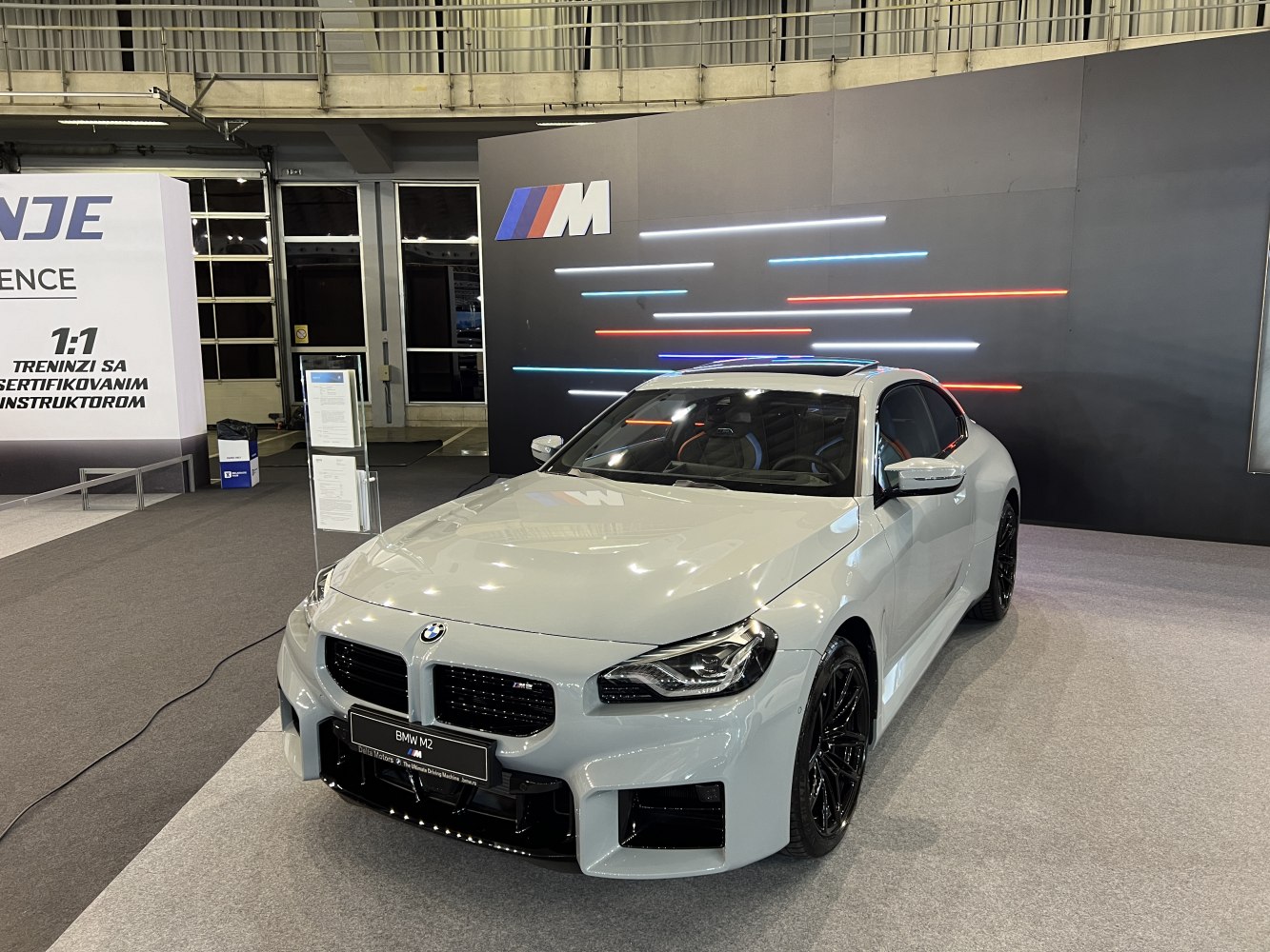 Front view of sporty coupe with aggressive grille and aerodynamic bumper