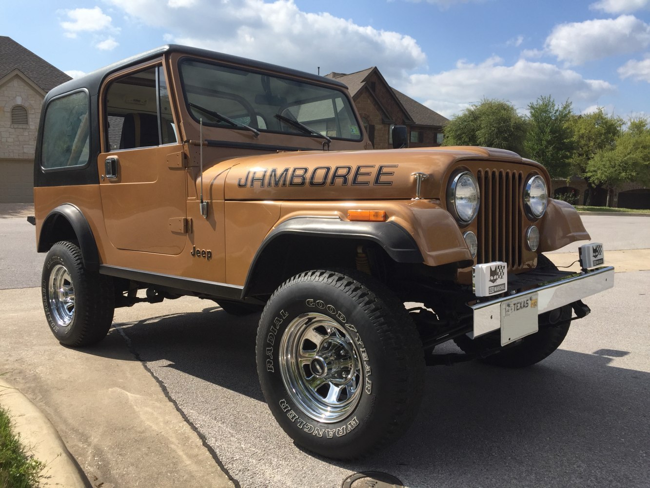 Vintage SUV with round headlights and rugged large tires