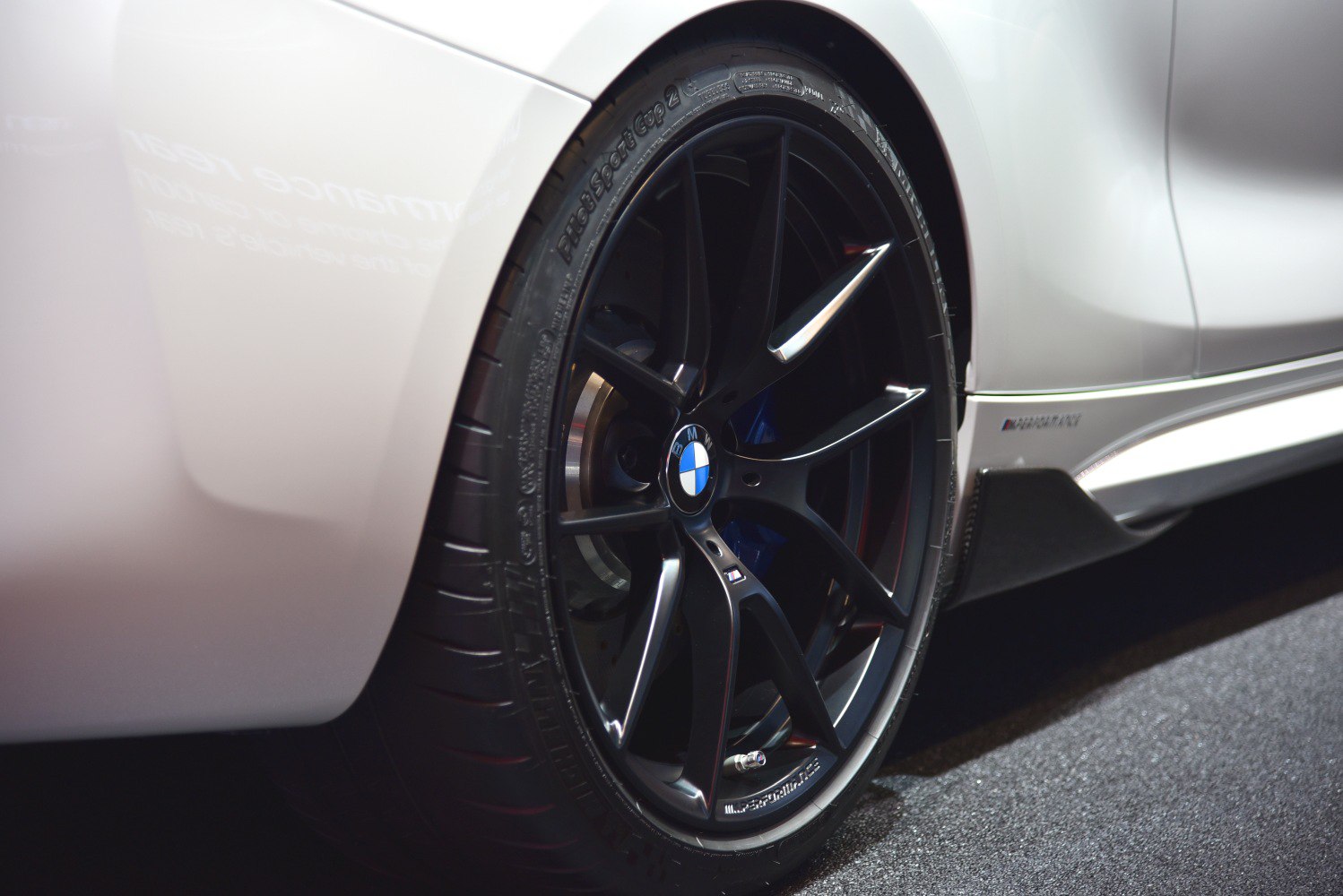 Close-up of black alloy wheel and tire on a sporty vehicle