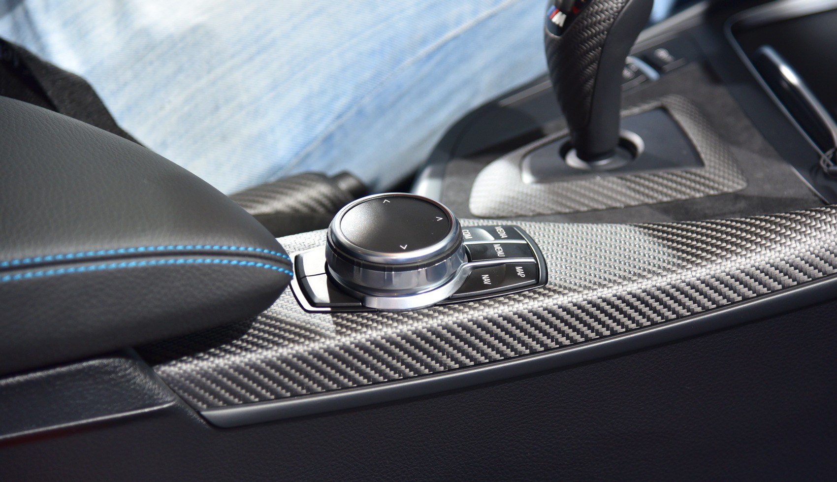 Carbon fiber center console with control knob and gear selector