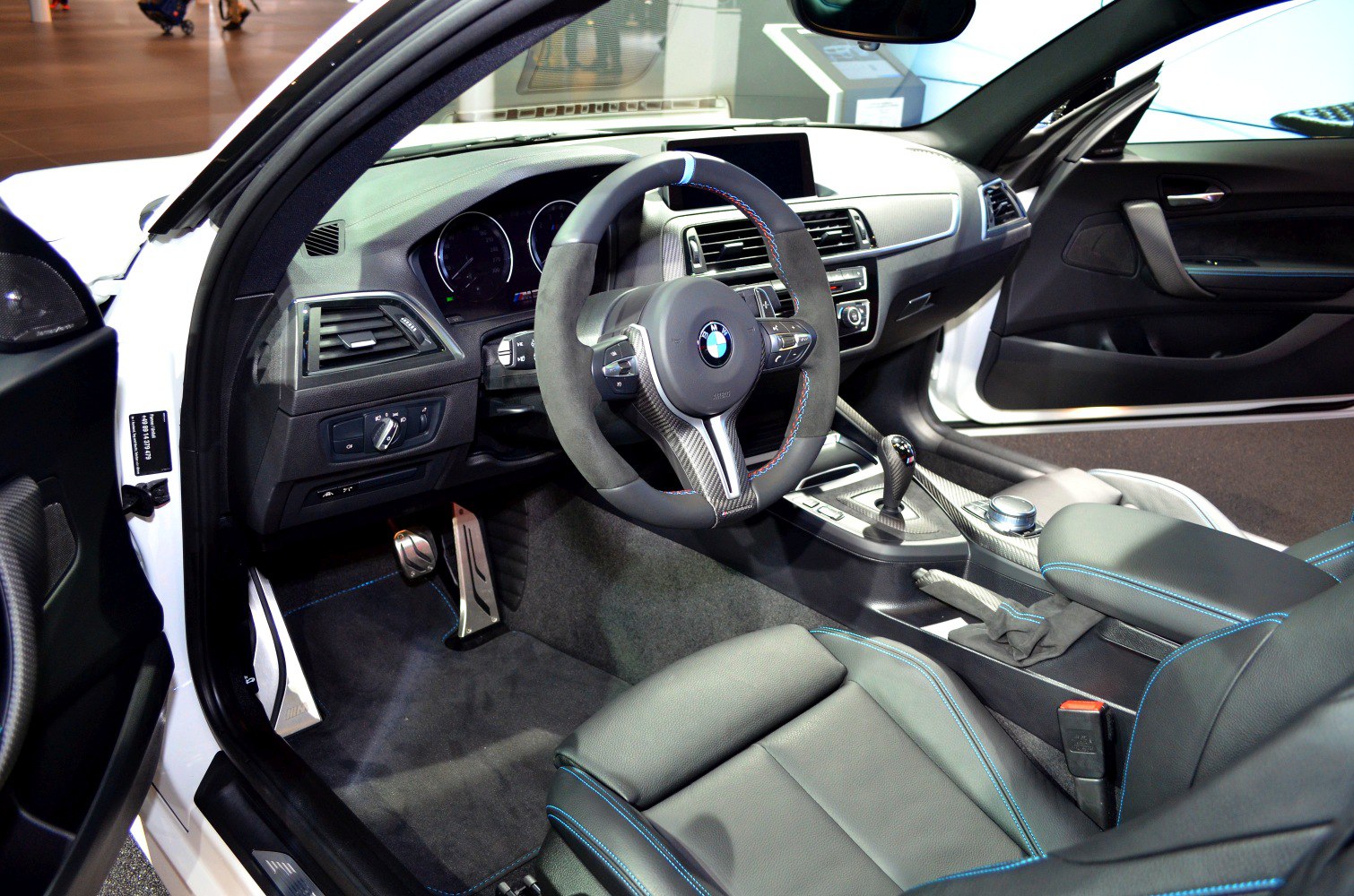 Steering wheel, dashboard, and center console with leather and carbon trim