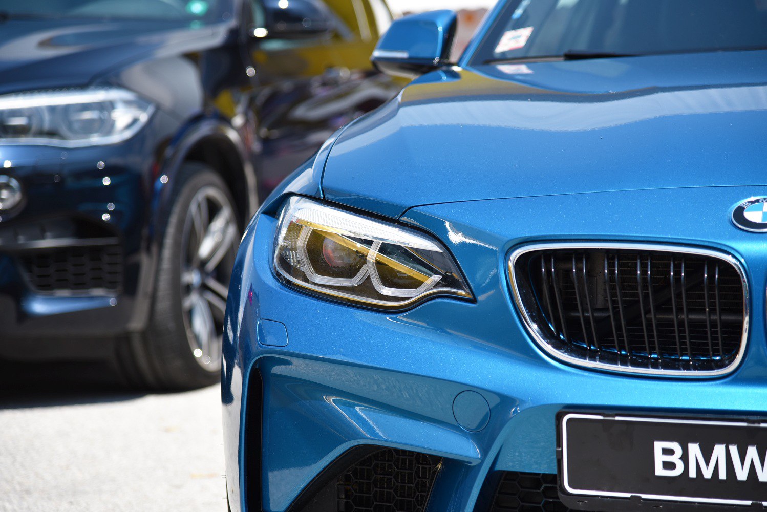 Close-up of front headlight and kidney grille