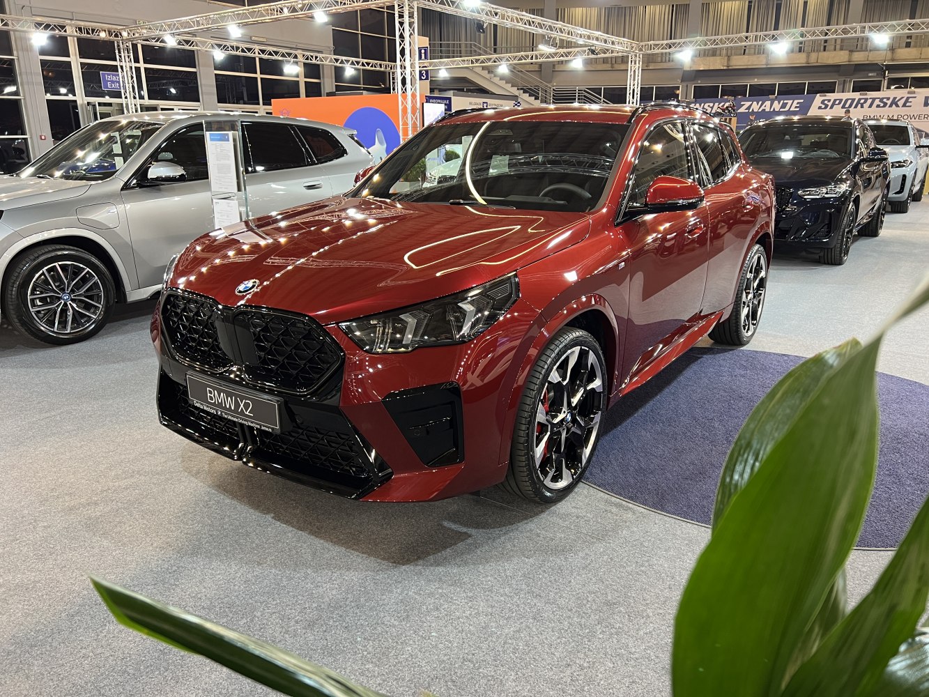 Front view of red SUV with black grille and alloy wheels