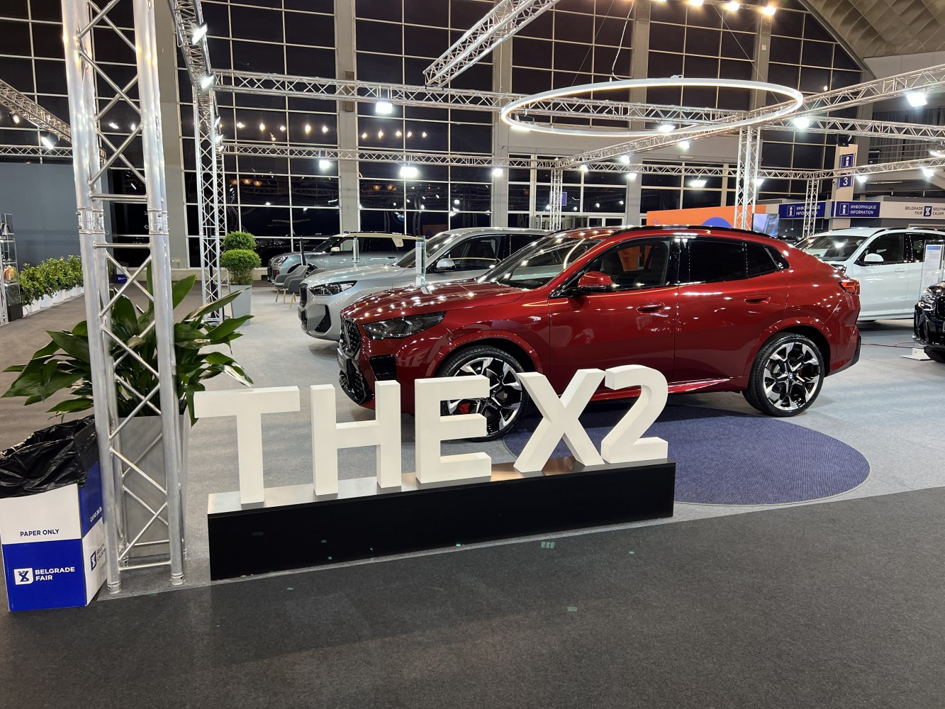 Front side view and unique wheel design of an SUV at an auto exhibition