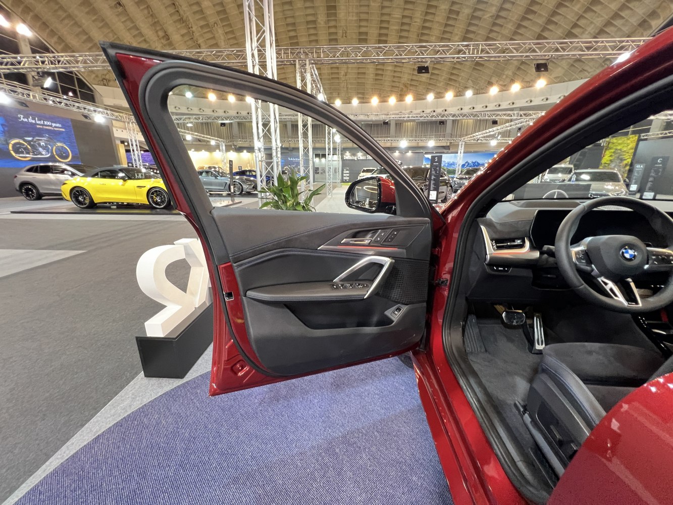 Interior door panel and driver side controls of a modern vehicle