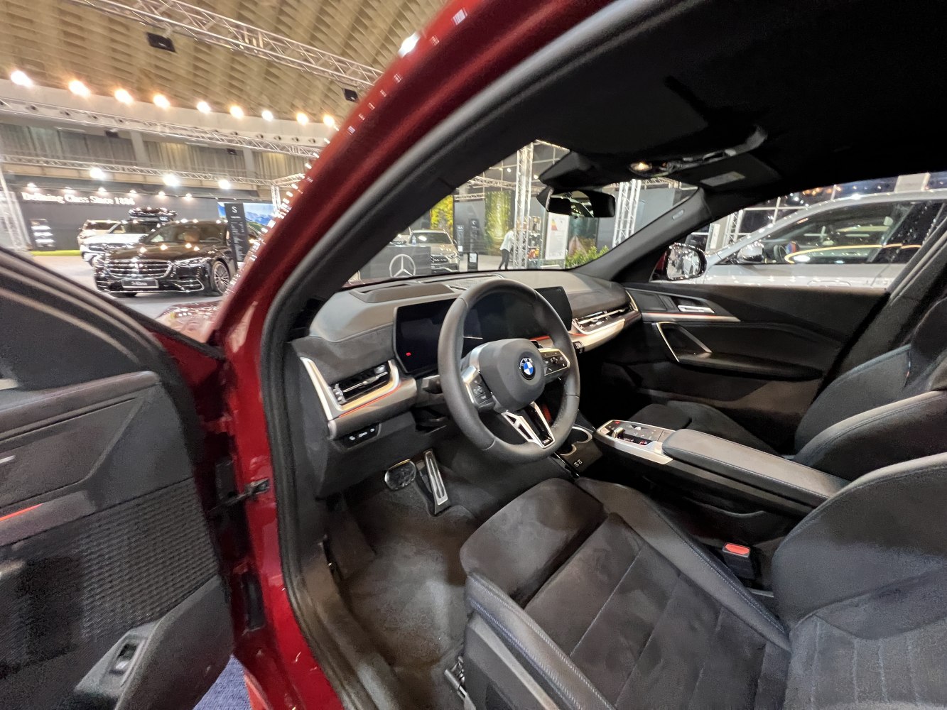 Modern car interior with sleek dashboard, steering wheel, and front seats