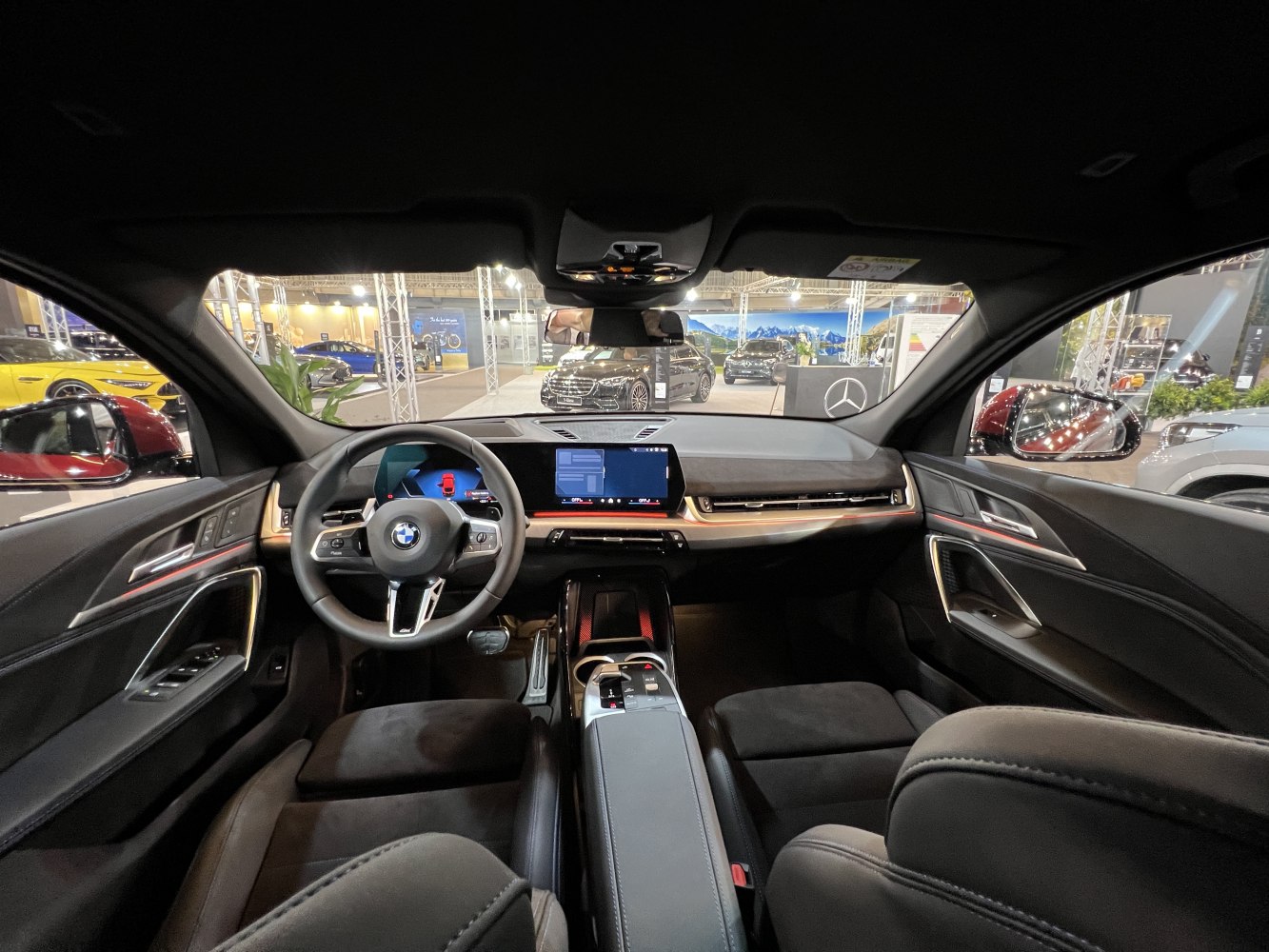 Digital instrument cluster and sleek steering wheel in luxury SUV interior