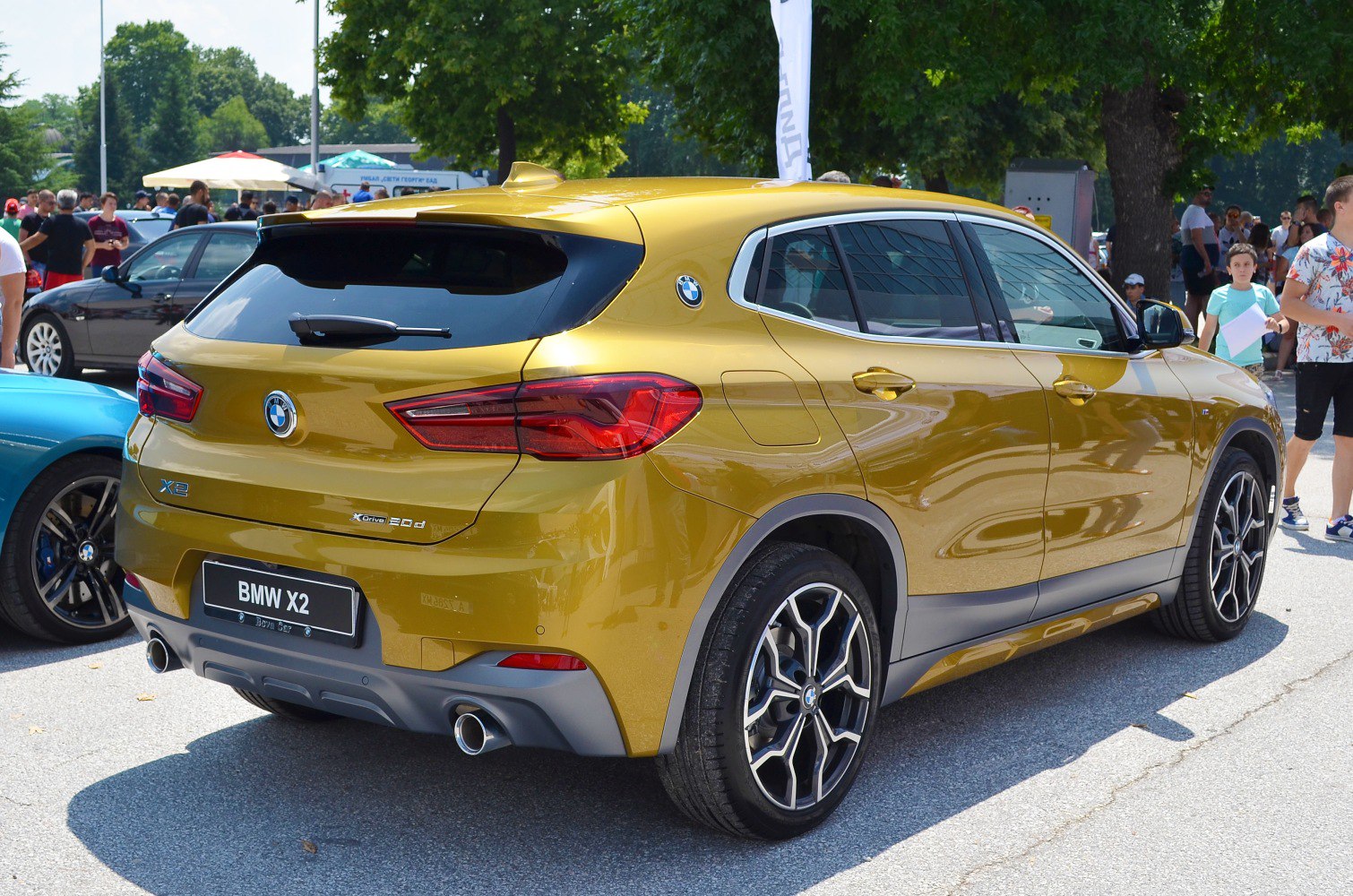 Rear side view of SUV showing dual exhaust and sporty taillights