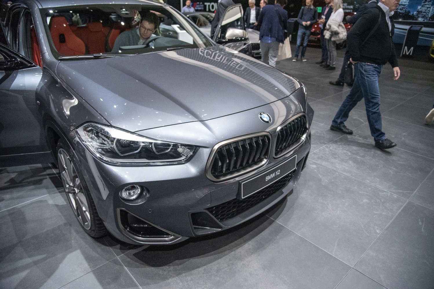 Front view of SUV with headlights and distinctive kidney grille.