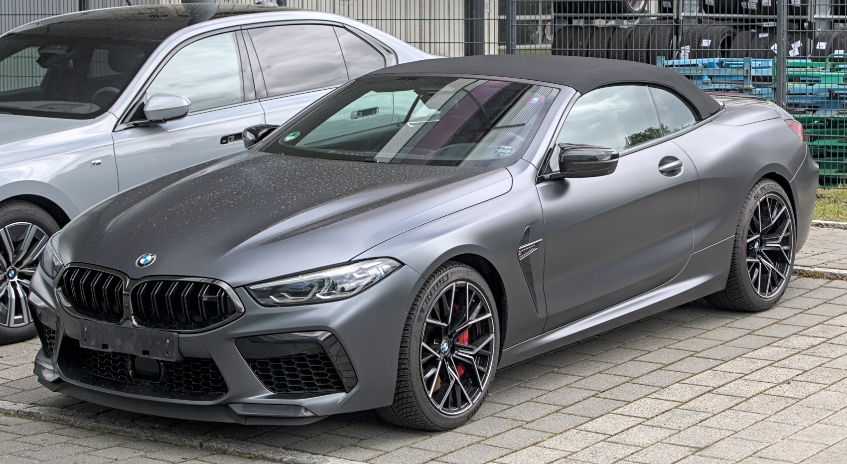 Sleek convertible soft top and aggressive front grille with intricate alloy wheels