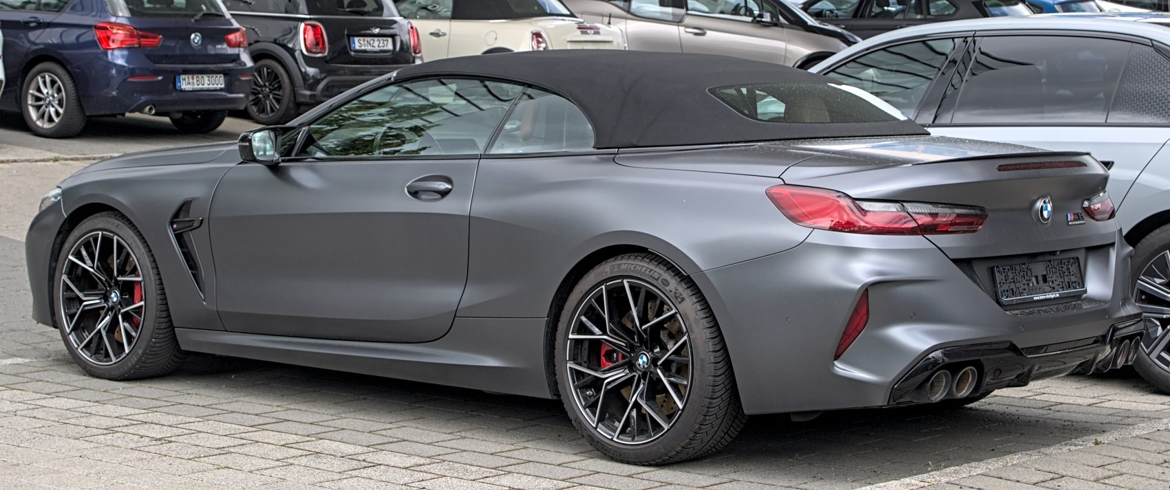 Matte grey convertible rear with quad exhaust and alloy wheels