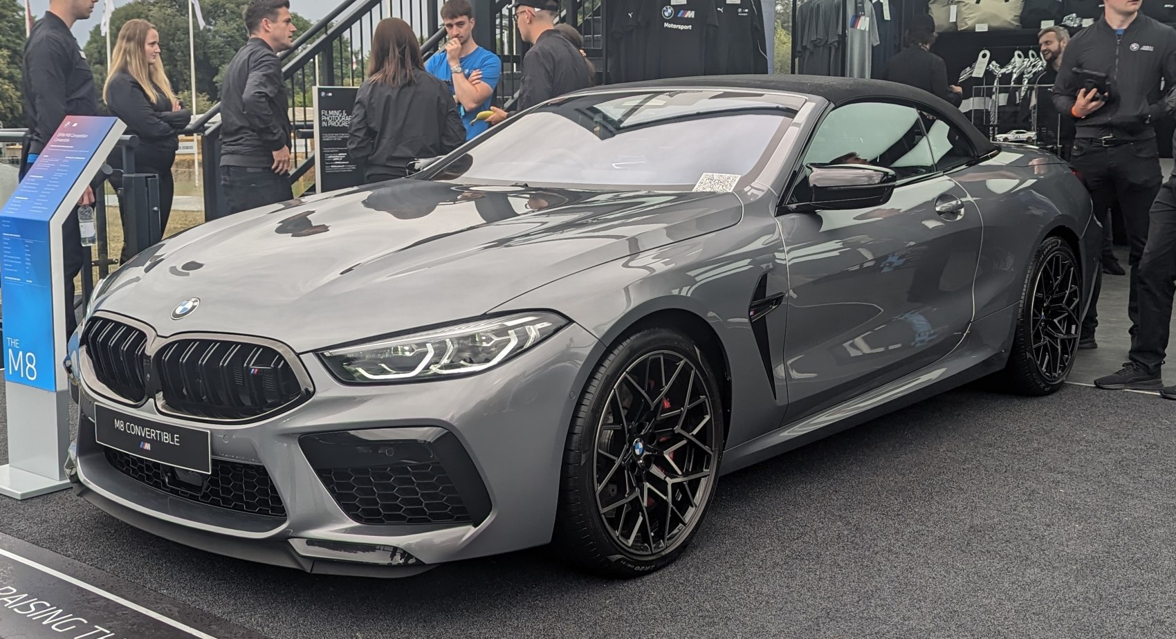 Gray convertible front view with kidney grille and alloy wheels