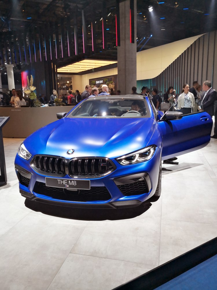 Front view with open door, aggressive grille and LED headlights
