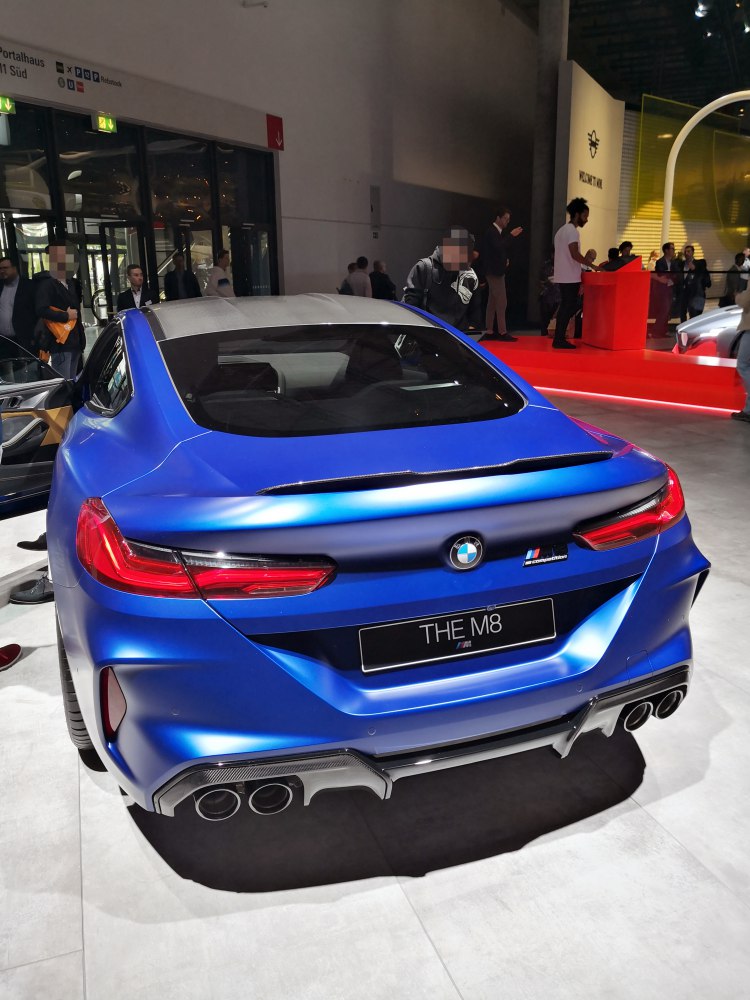 Rear view with quad exhaust and sleek taillights