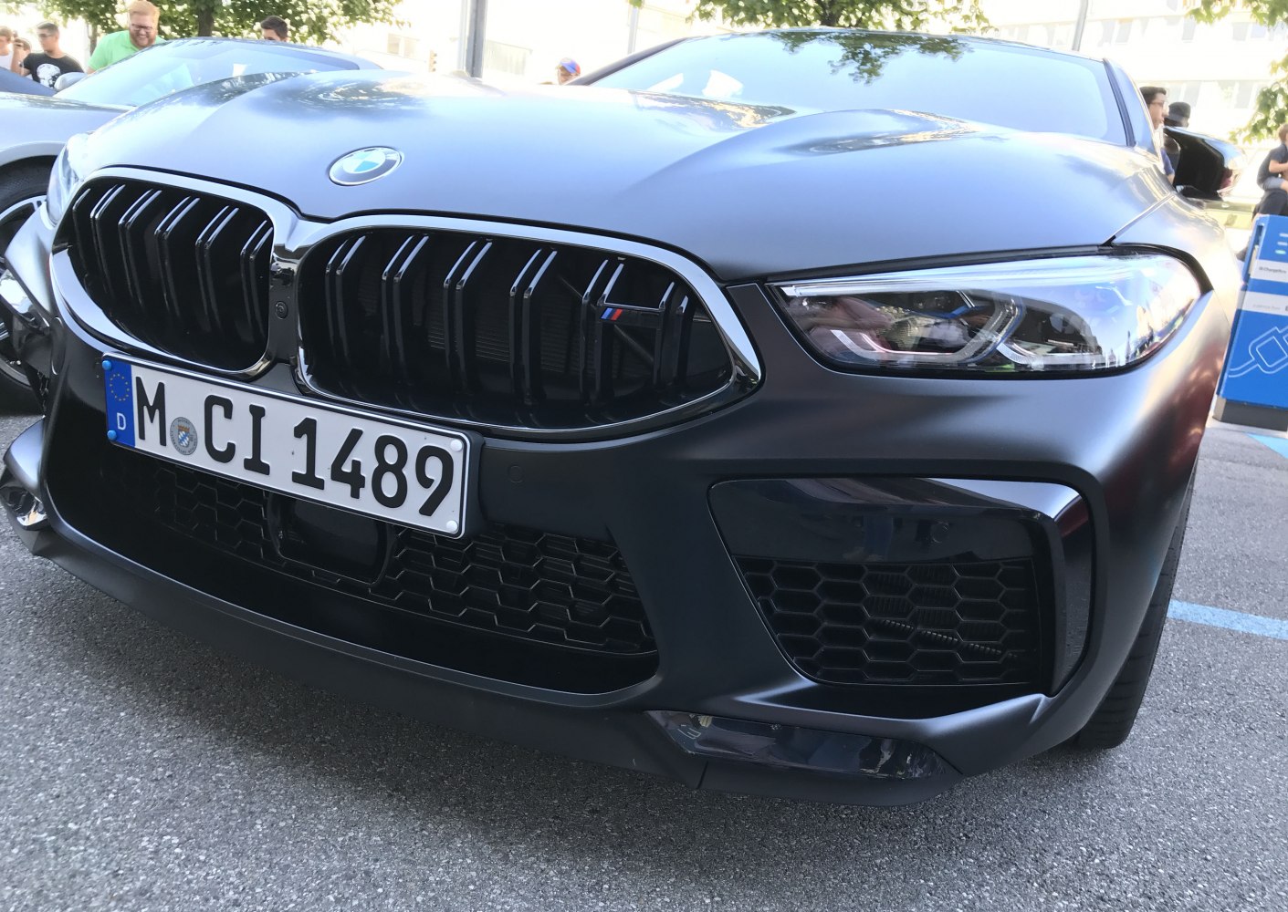 Aggressive front grille and sleek headlight of a sporty coupe