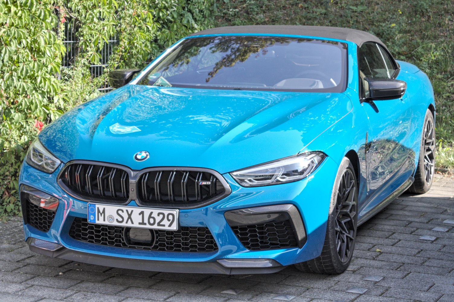 Aggressive front grille and sharp LED headlights on a convertible