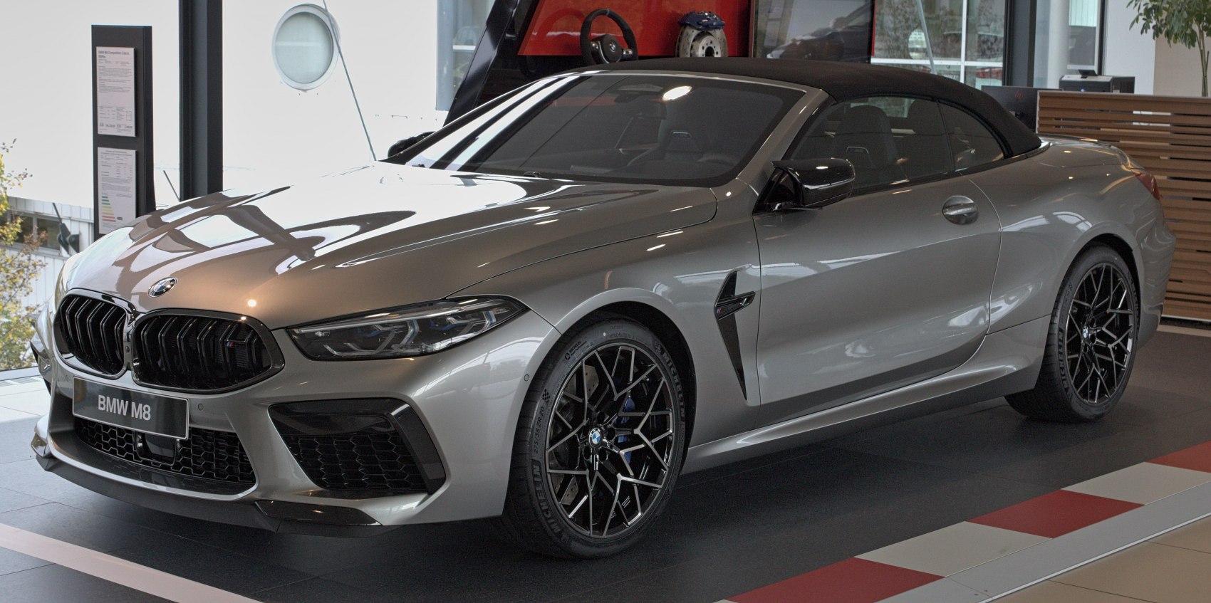 Front view of a sporty convertible with aggressive grille and black alloy wheels