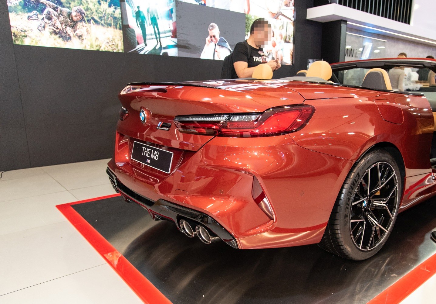 Rear view of convertible with quad exhaust and sleek tail lights