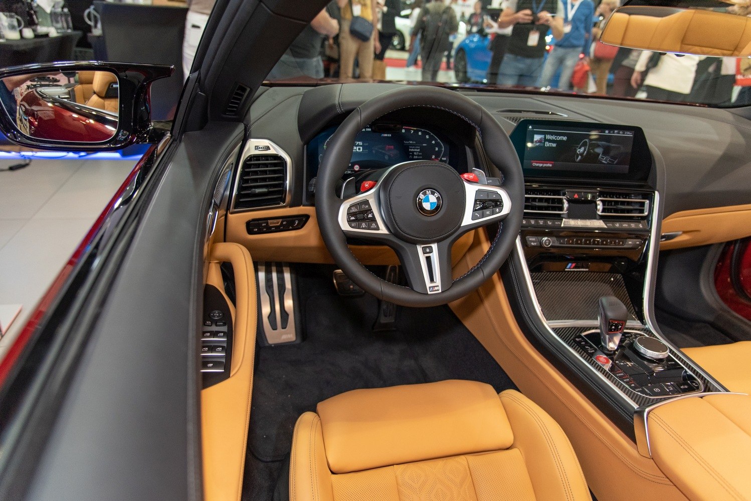 Luxury convertible interior with digital dashboard and tan leather upholstery