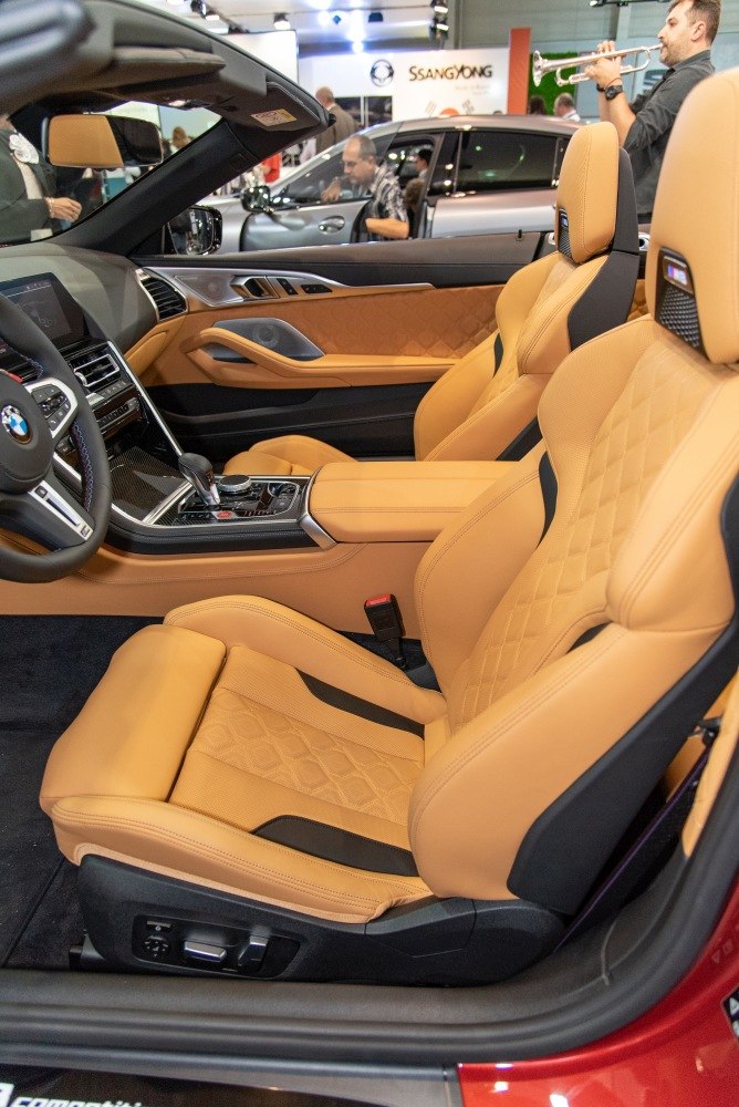 Tan leather quilted seats and modern convertible interior features