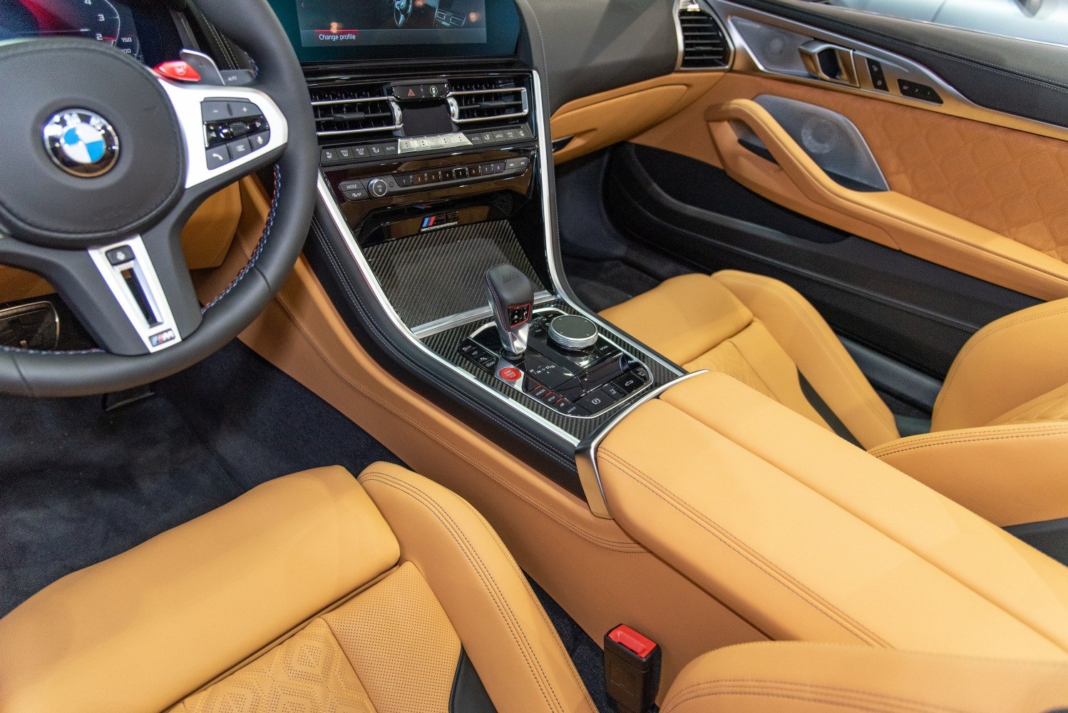 Luxury tan leather seats, carbon fiber center console, BMW M performance interior