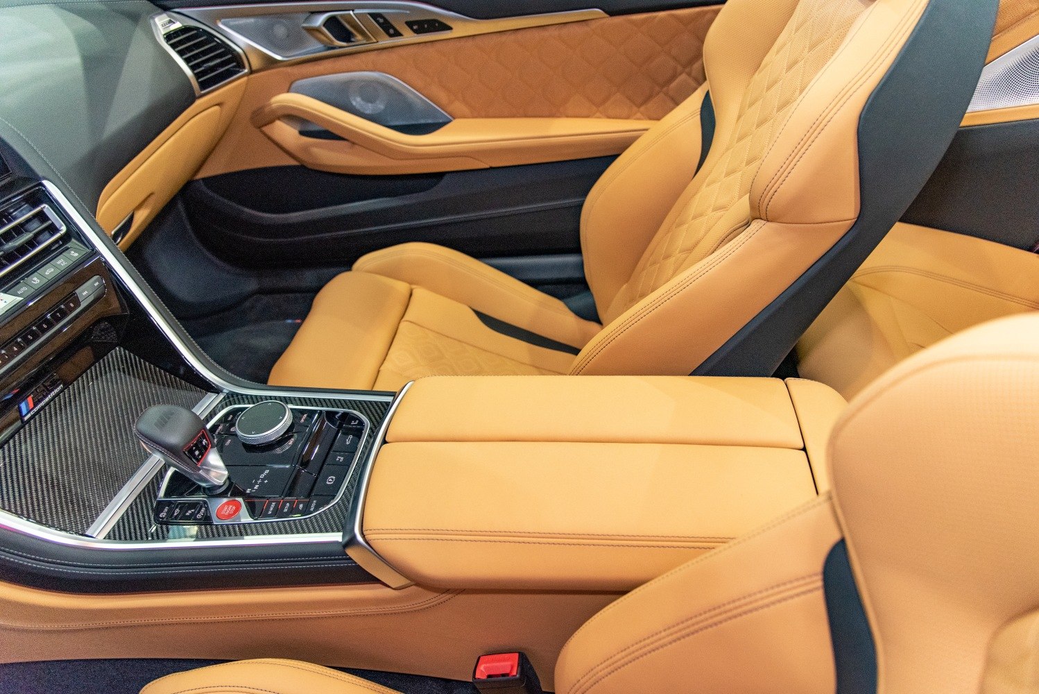 Tan leather seats with quilted door panel and advanced center console controls