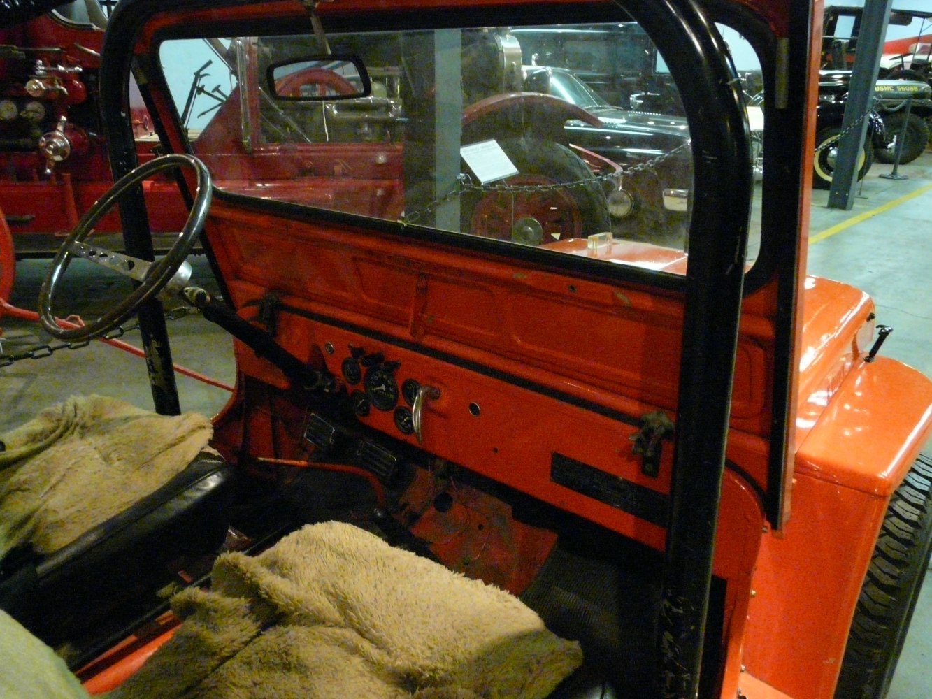 Simple dashboard and steering wheel in vintage off-road vehicle interior