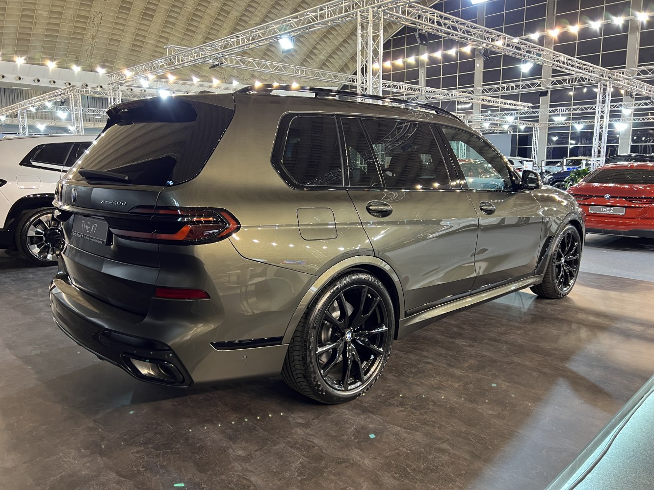 Rear-side view of luxury SUV with black alloy wheels and modern taillights