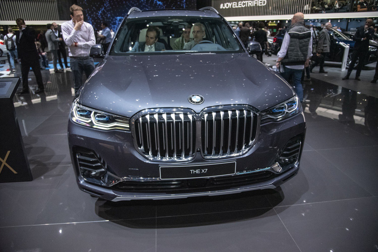 Prominent kidney grille with LED headlights of a luxury SUV front.