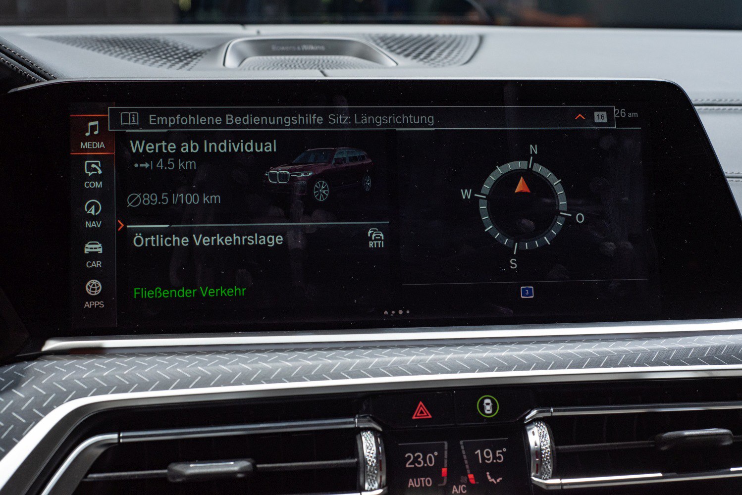 Infotainment screen showing navigation, traffic, and vehicle data