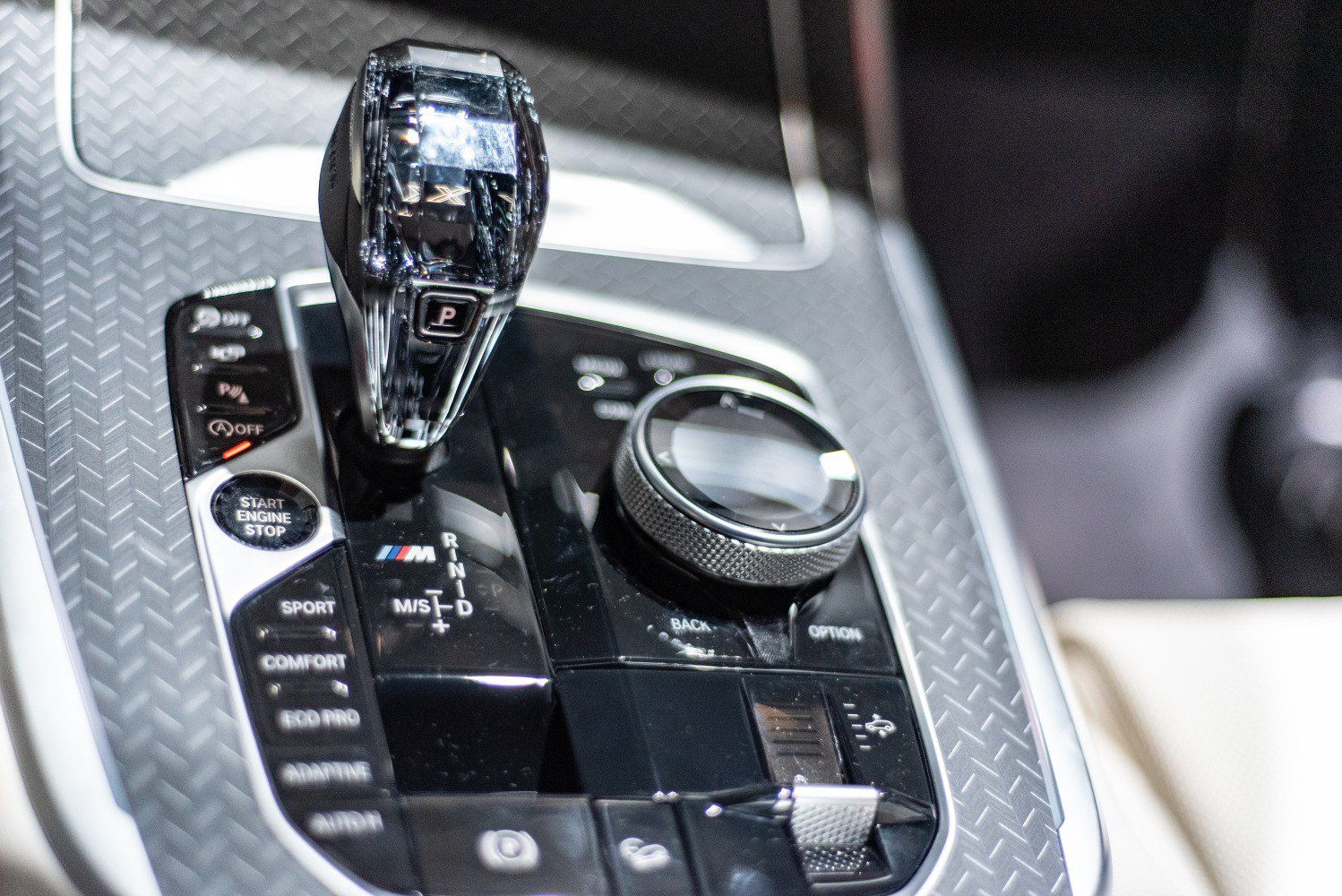 Crystal gear shifter with drive mode and infotainment controls