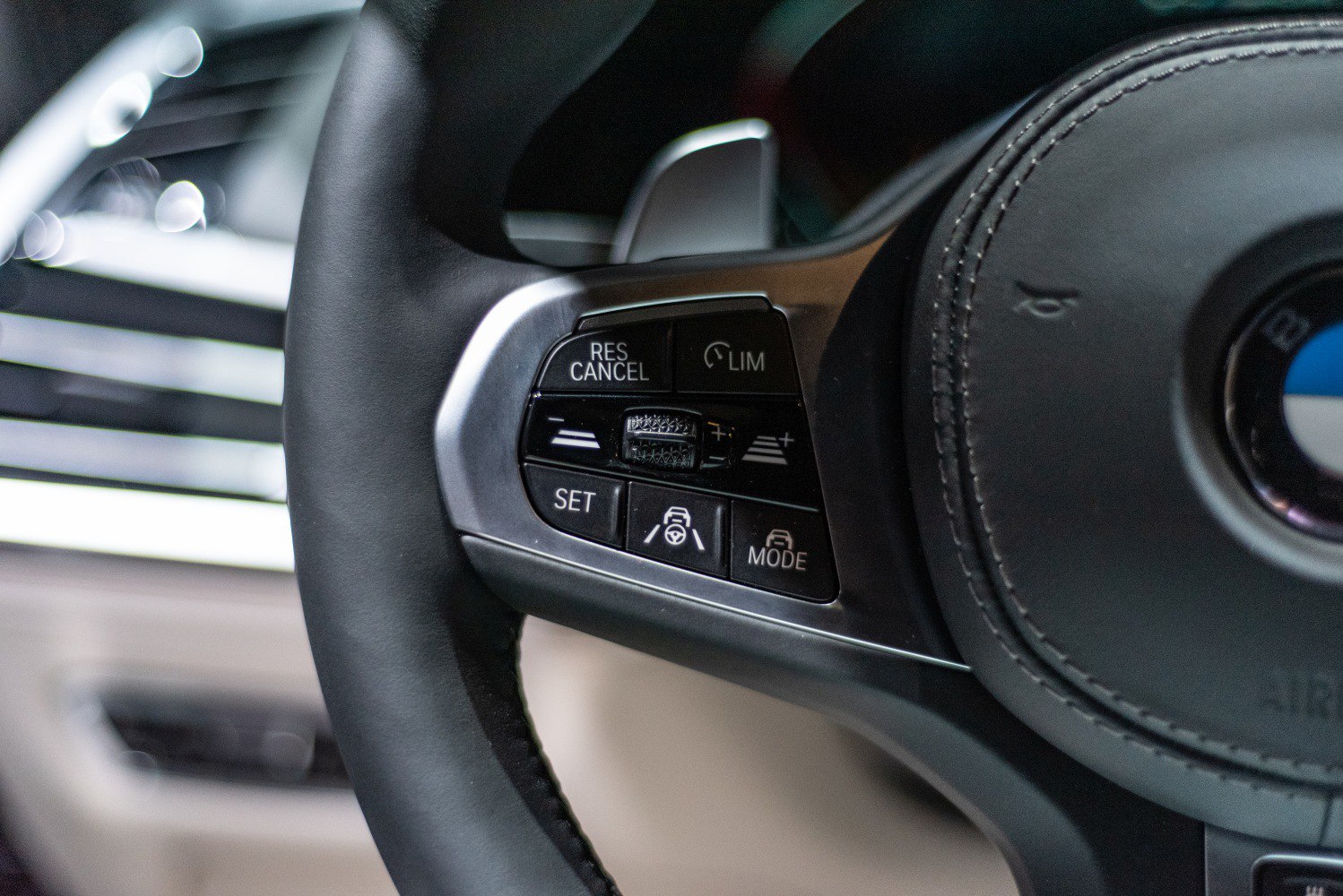 Steering wheel cruise control and lane assist buttons